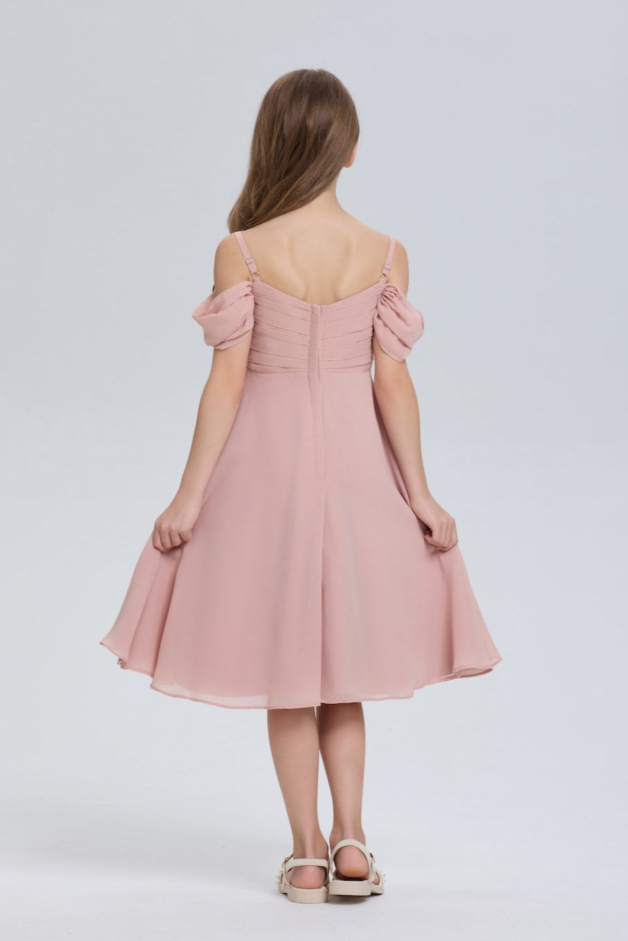 Back view of a pink chiffon flower girl dress with puff sleeves by Wehilion, perfect for special occasions