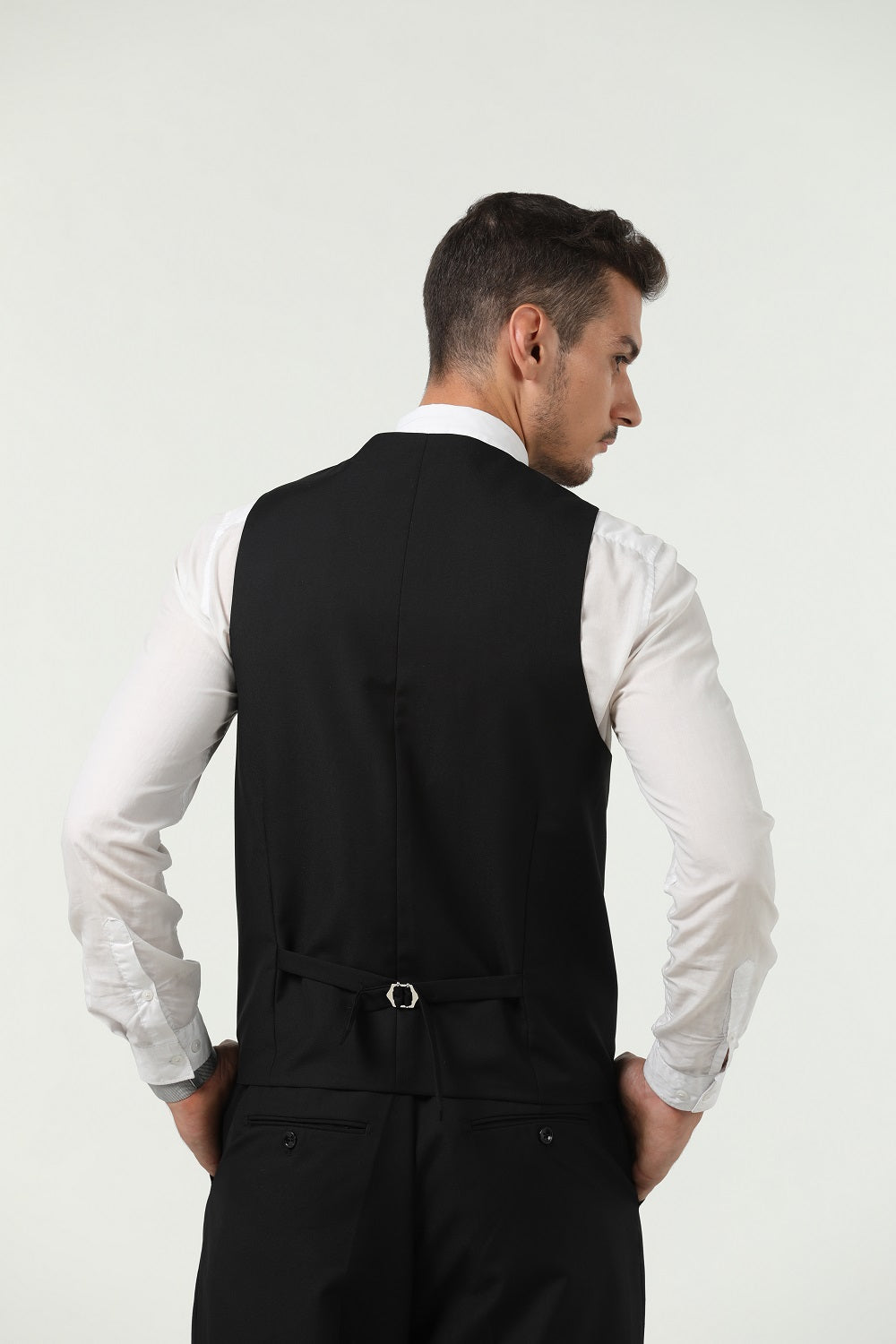 Back view of black vest and pants set – classic men's 2-piece suit styling