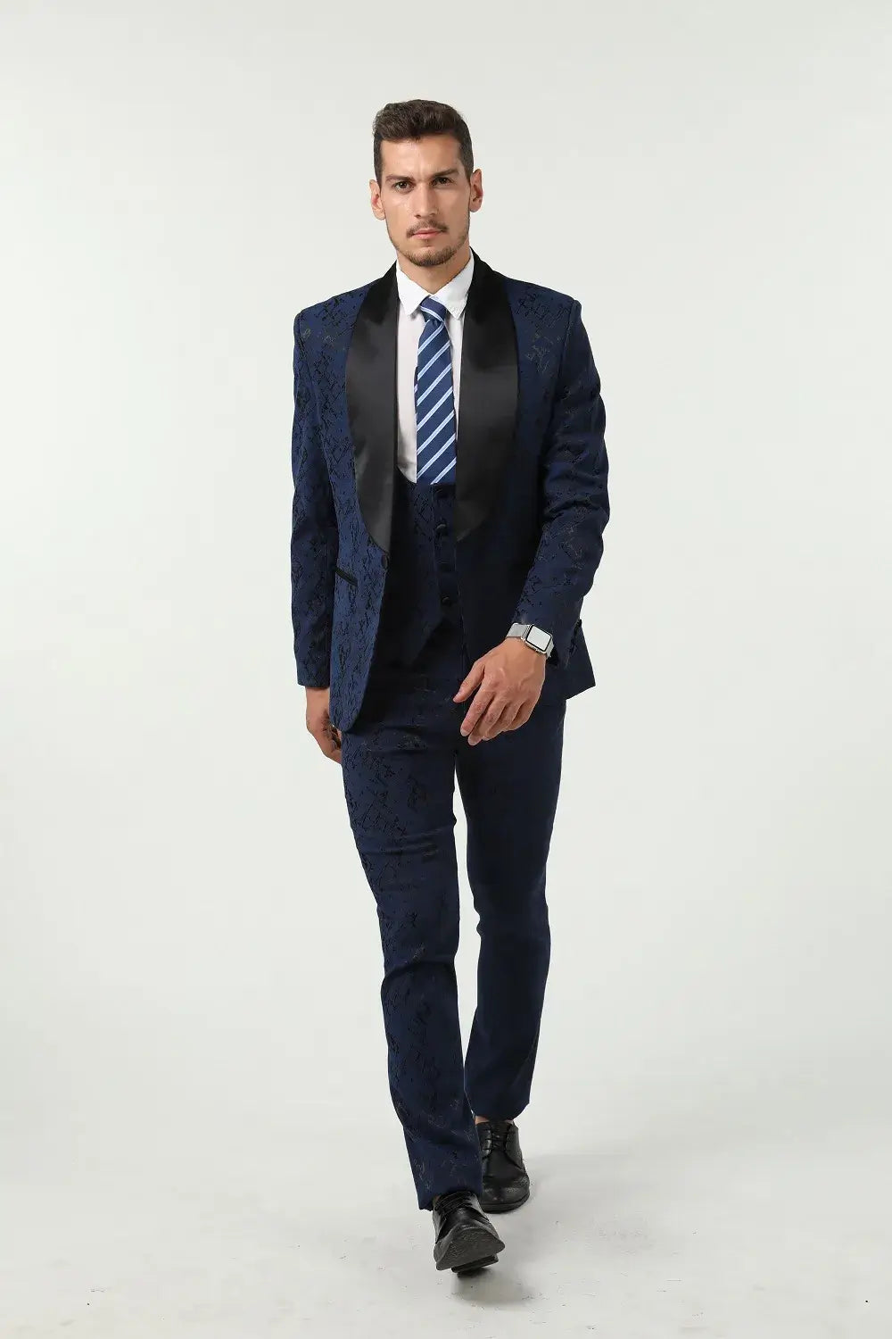 Men’s navy 3 piece prom suit with unique pattern – sharp walking pose in formal partywear
