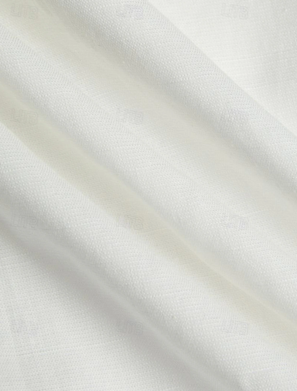 Soft texture white linen fabric detail – lightweight and airy for warm weather outfits
