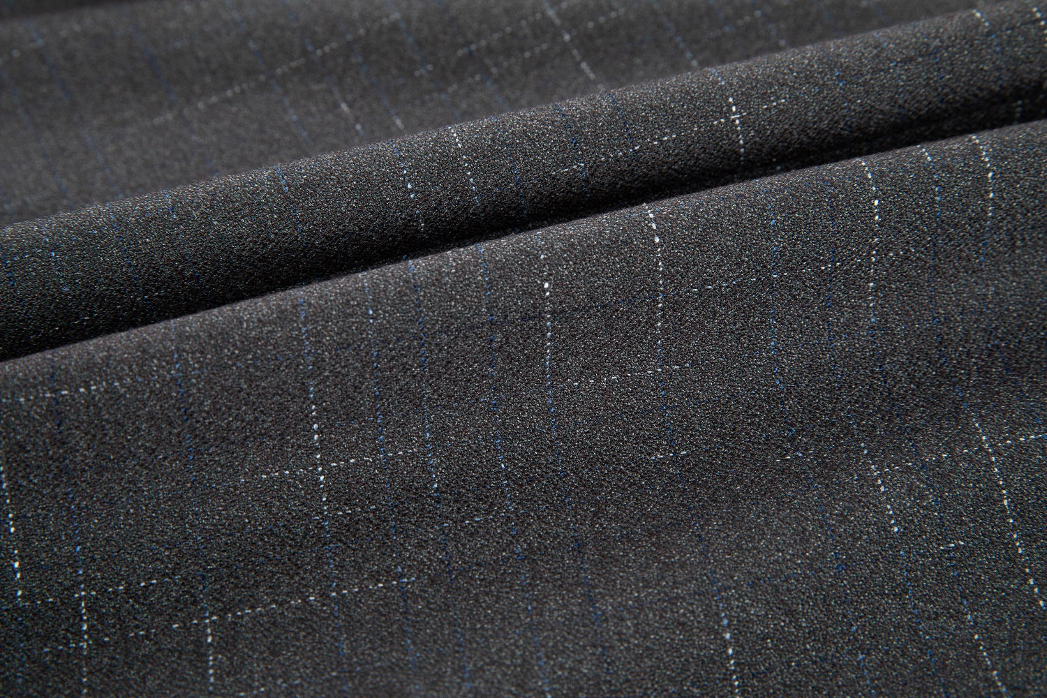 Fabric texture detail of grey plaid dress pants – classic pattern for formal wear