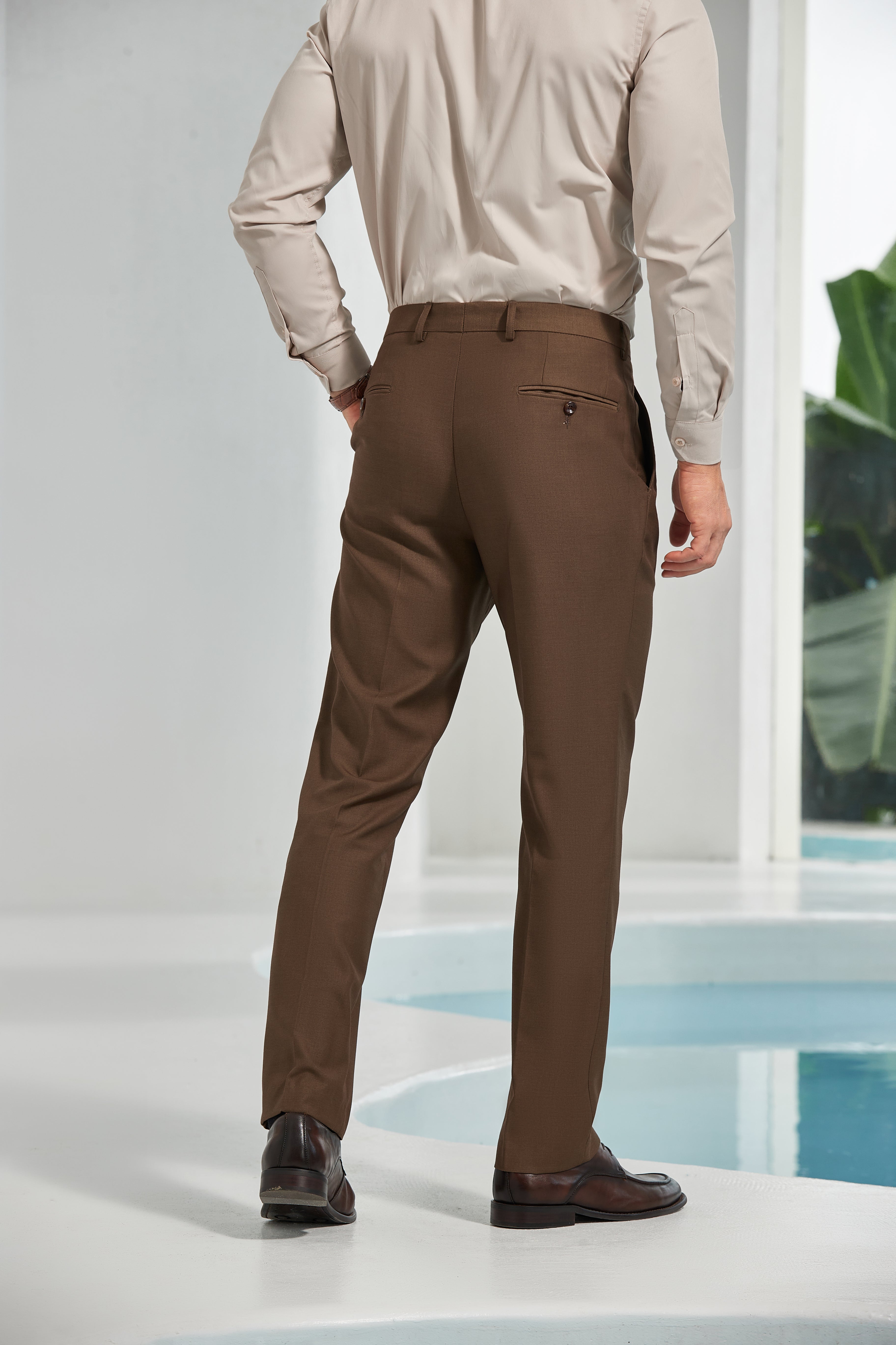 Back view of coffee slim fit formal trousers – wrinkle-resistant pants with buttoned rear pockets