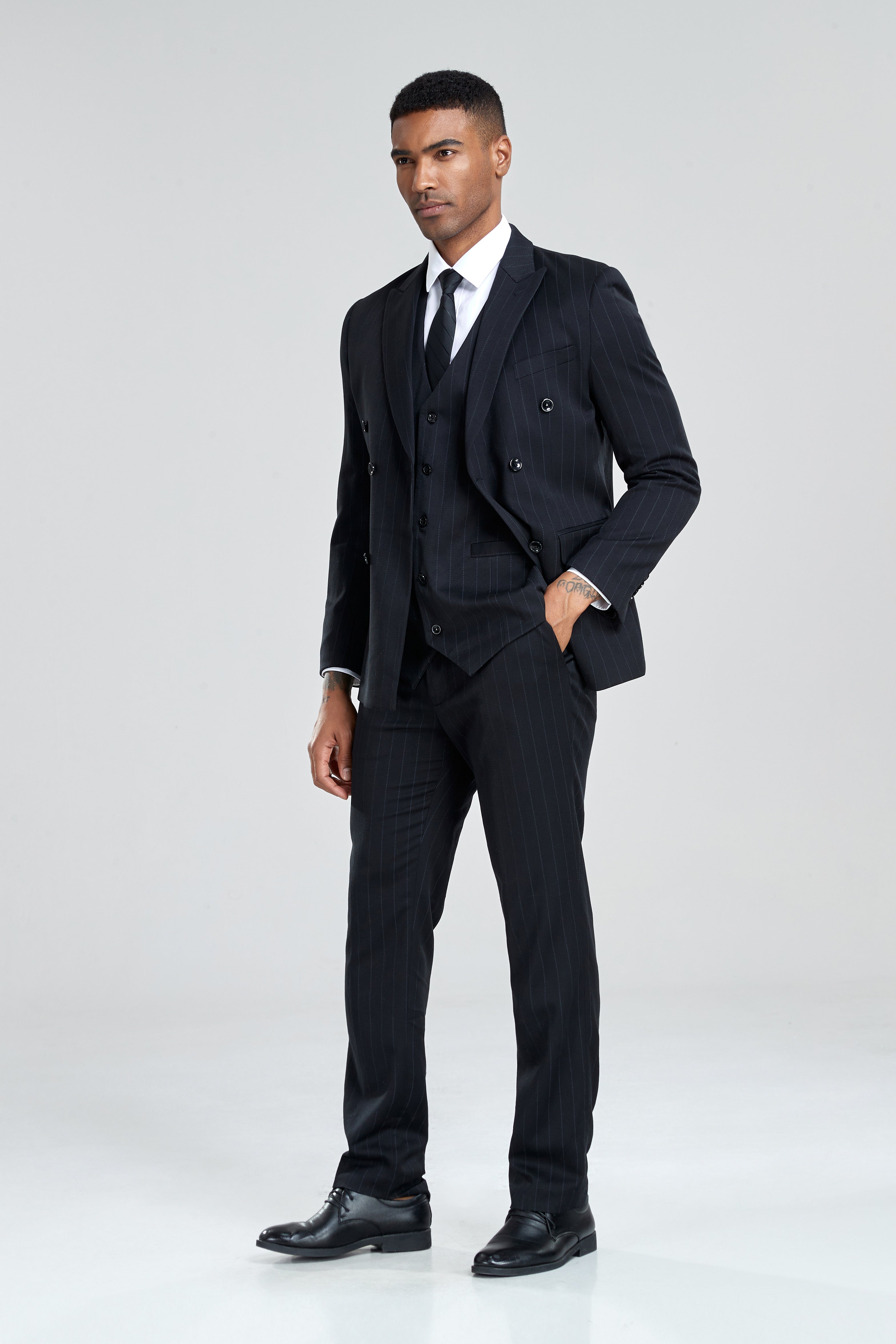 Black pinstripe suit with timeless appeal and elegant detailing