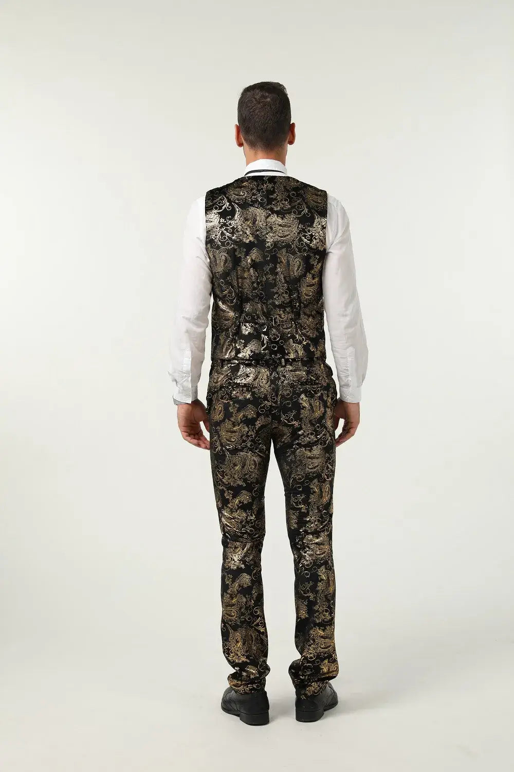 Back view of gold floral suit vest and trousers – fashion-forward party outfit for men