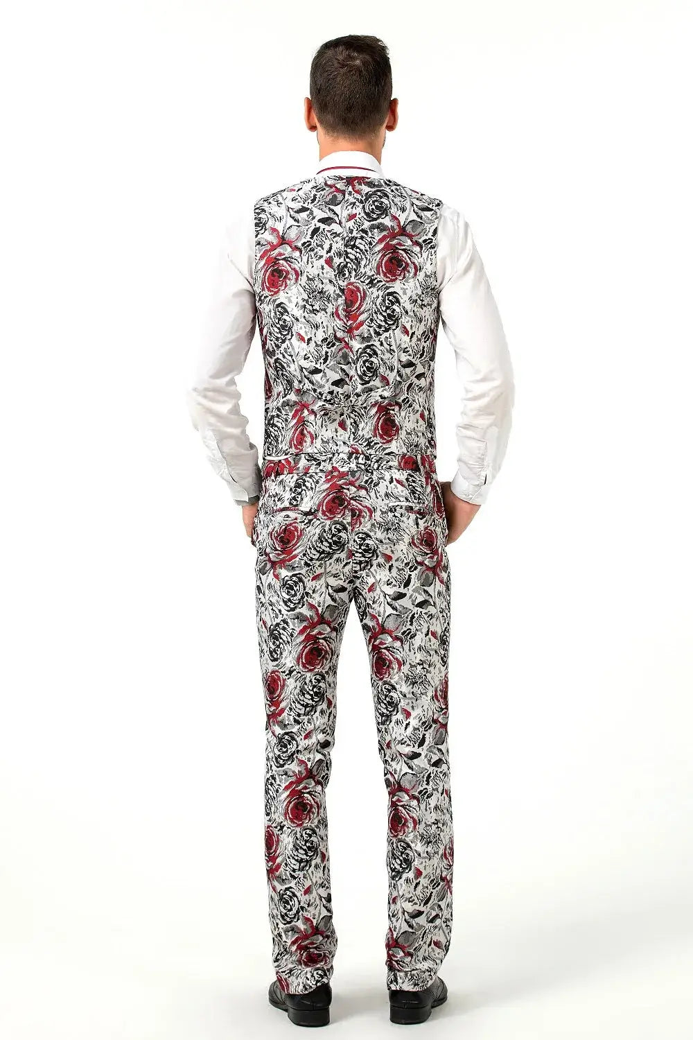 Back view of red floral suit vest and trousers in rose pattern – fashion-forward party look