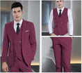 Load image into Gallery viewer, model wearing burgundy double-breasted men's 3 piece suit – includes slim fit blazer, vest, and tailored pants