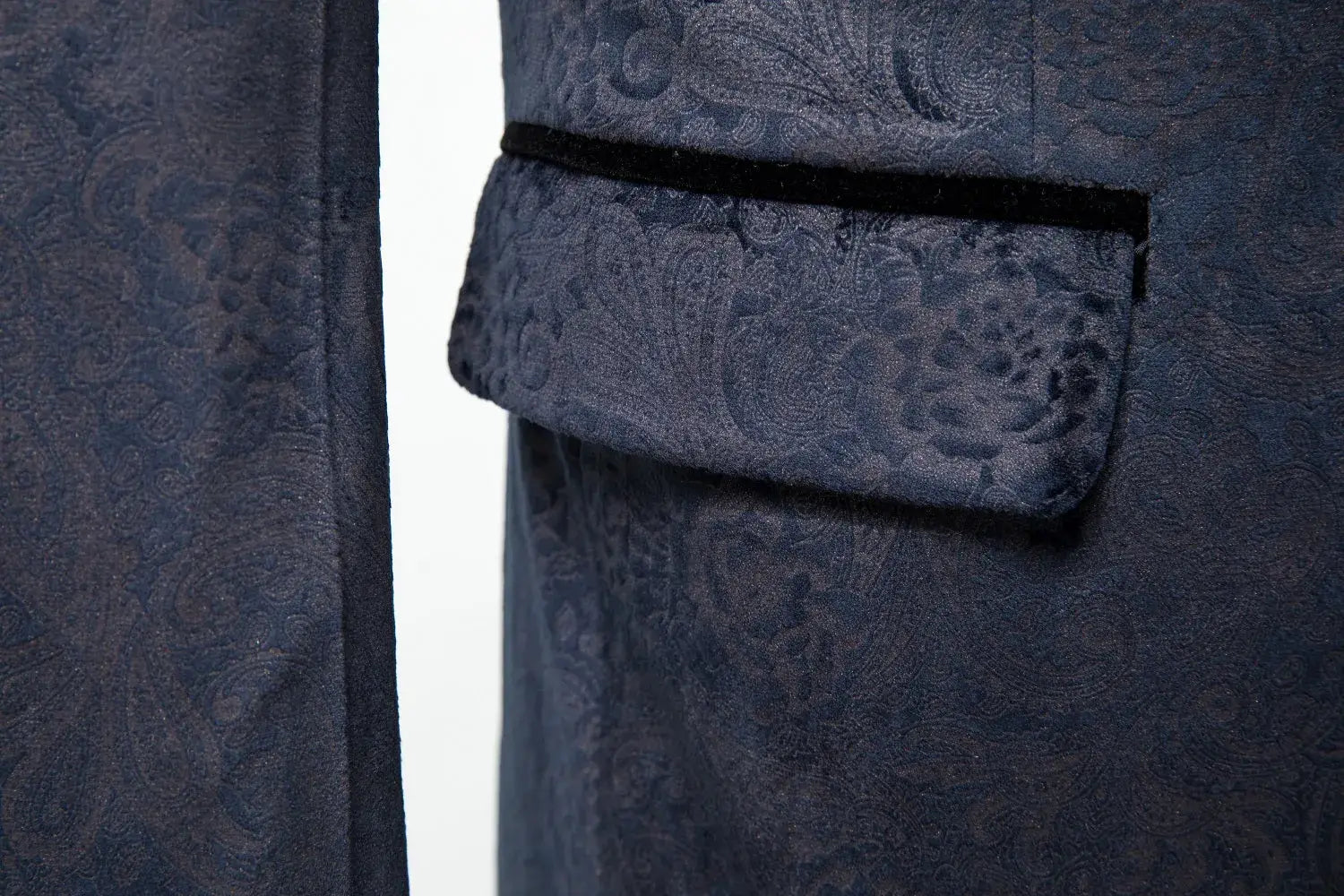 Close-up of men's navy velvet party suit – patterned fabric with black velvet lapel