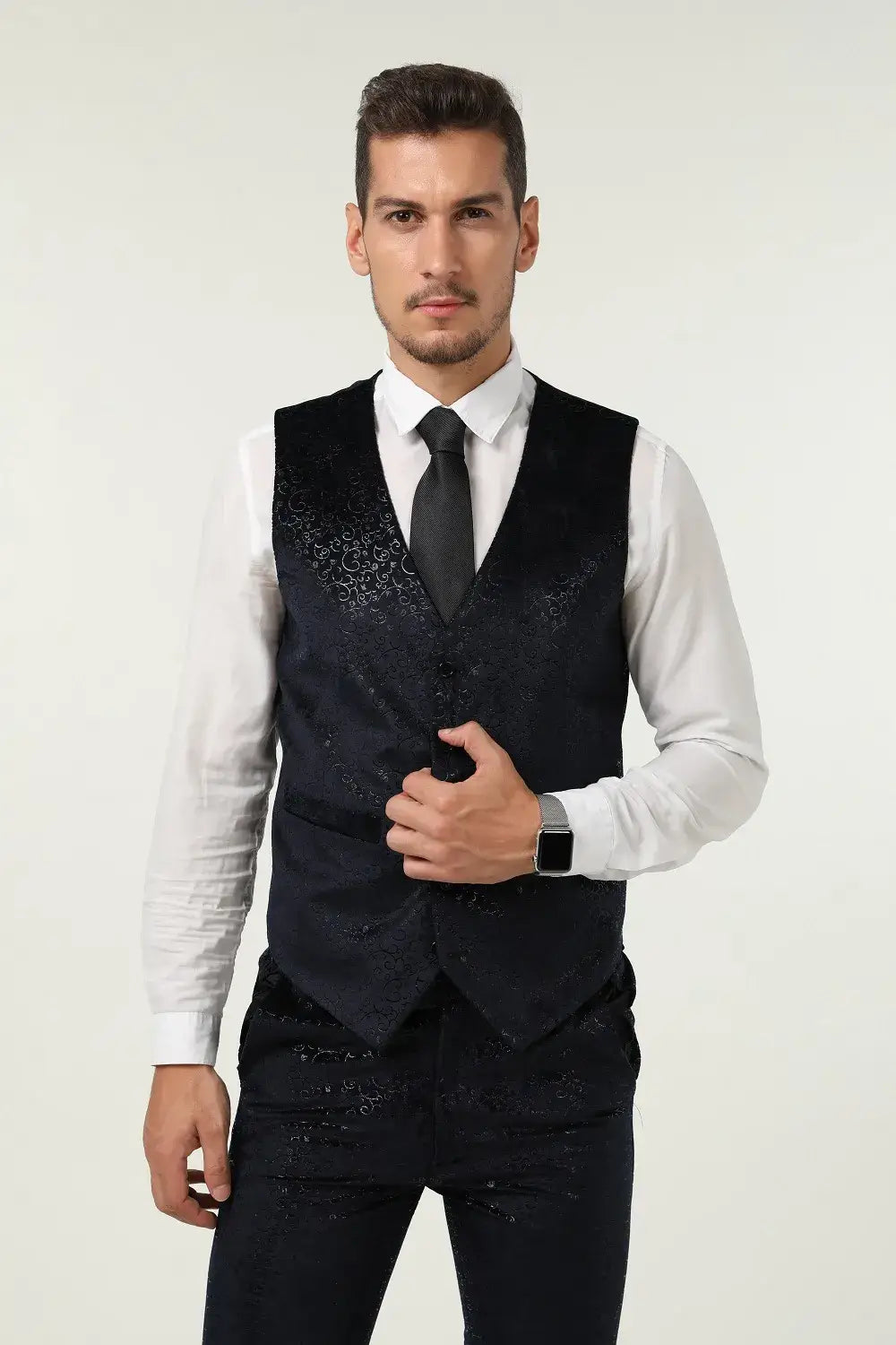 Close-up of navy velvet suit vest – subtle jacquard pattern and button detailing from 3 piece prom tuxedo set