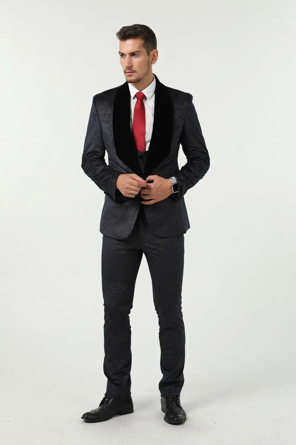 Front view of men's navy patterned velvet 3 piece suit – jacket open with red tie