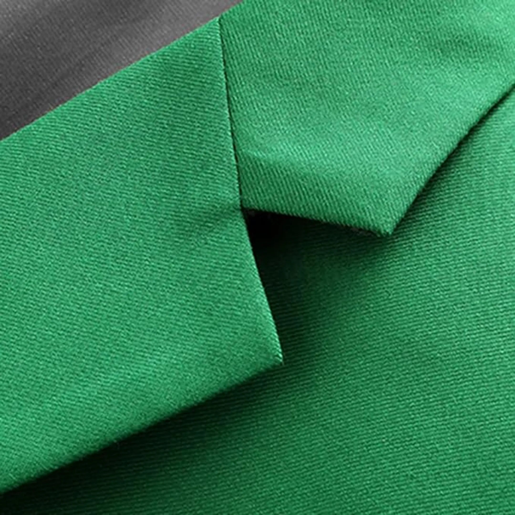 close-up of men's green suit collar and fabric texture, showcasing the smooth finish and quality stitching of the single-breasted design.