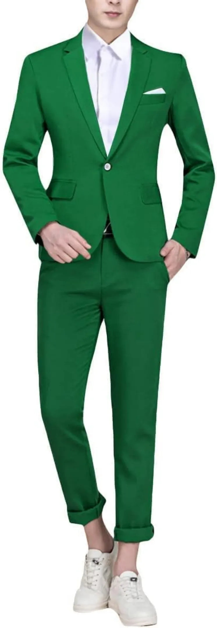 model wearing a green single-breasted one button suit, paired with a white shirt and sneakers for a modern take on formal and casual attire.