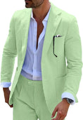 Load image into Gallery viewer, Green-and-white striped seersucker blazer styled with a summer shirt for a fresh and comfortable look.