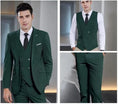 Load image into Gallery viewer, model wearing hunt green double-breasted 3 piece men's suit showing blazer, vest and trousers for business and prom occasions