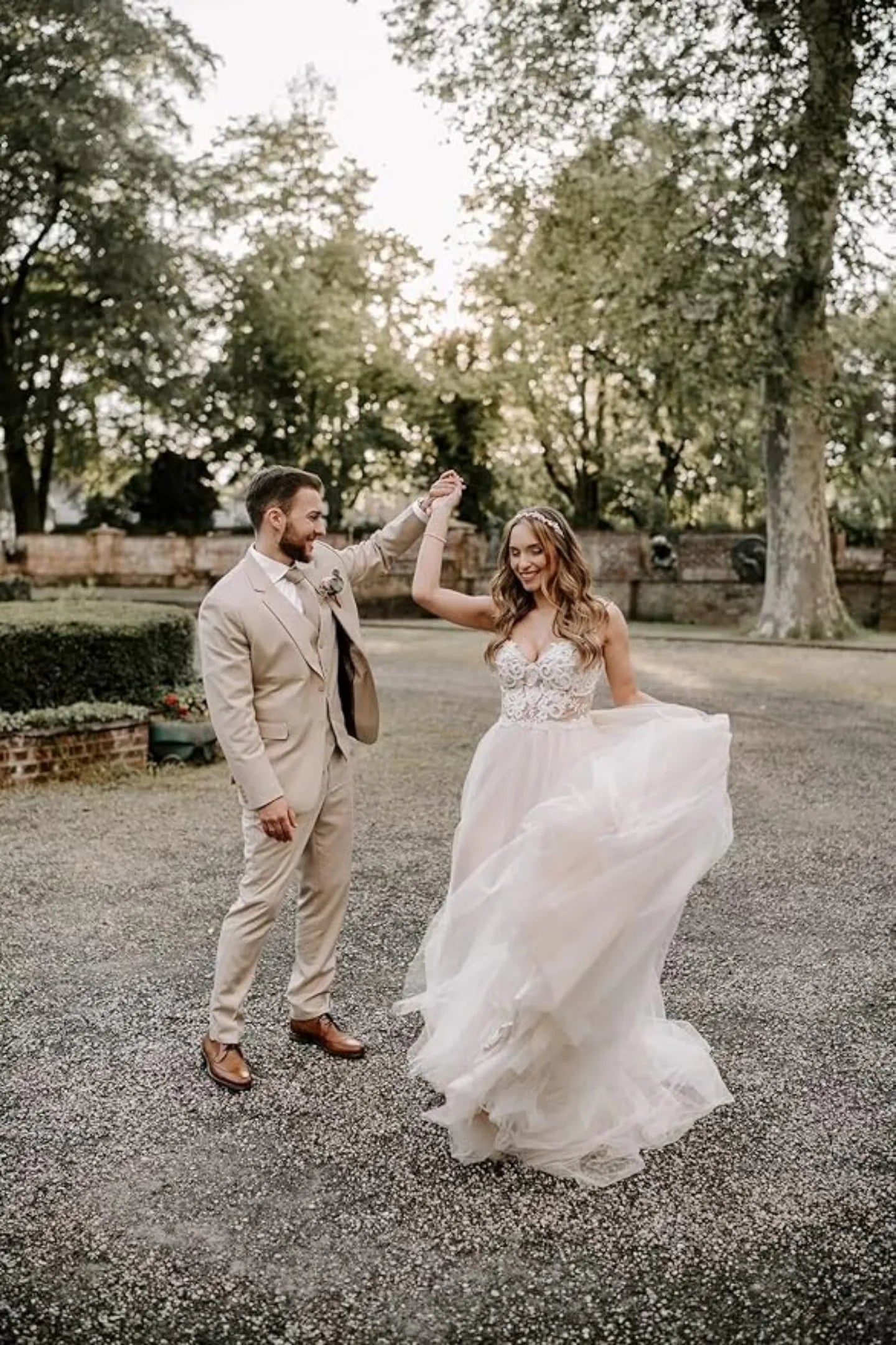 men's beige 3 piece suit for wedding with vest, worn by groom dancing with bride