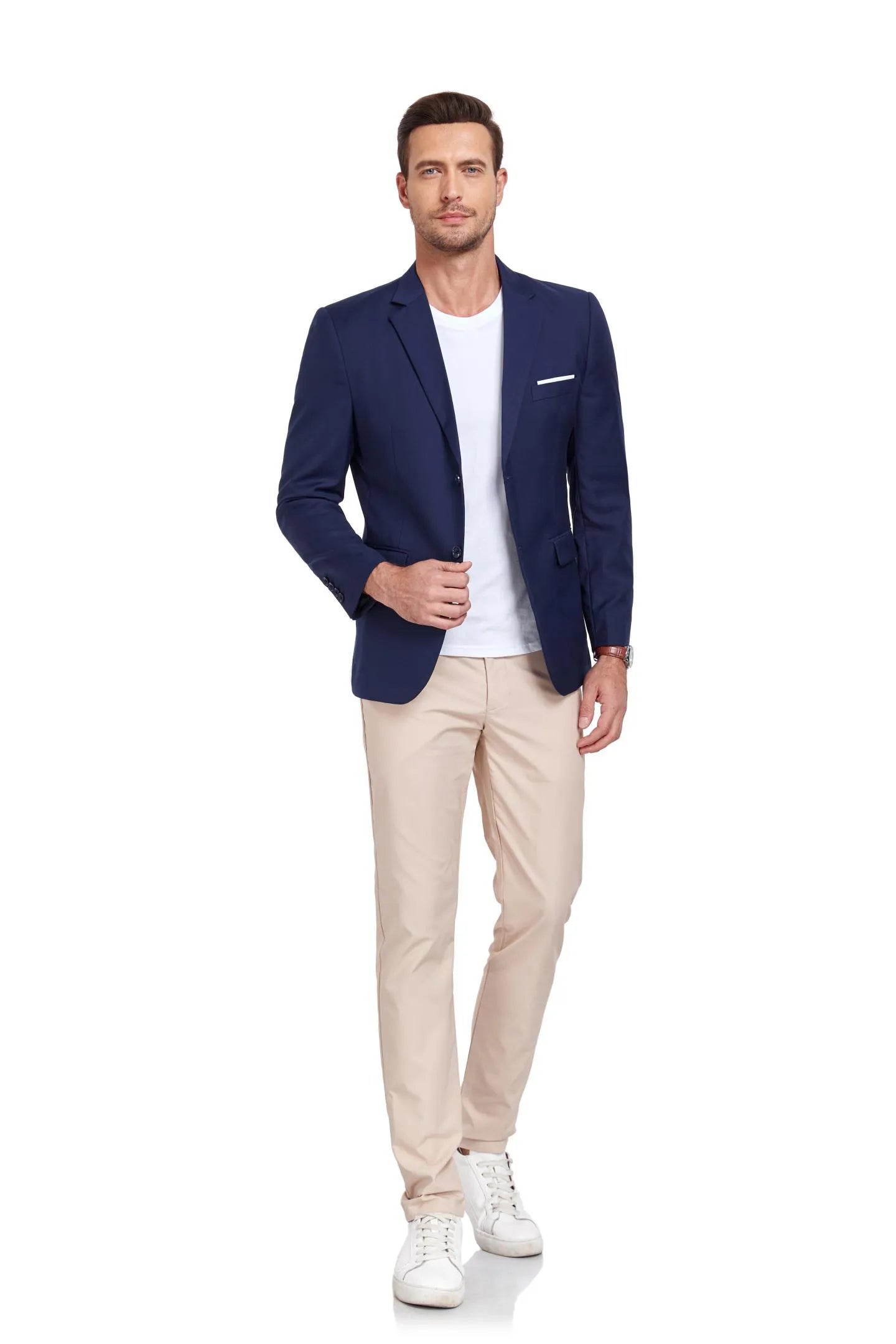 model walking confidently in navy two-button blazer with beige pants and white sneakers – ideal for events.