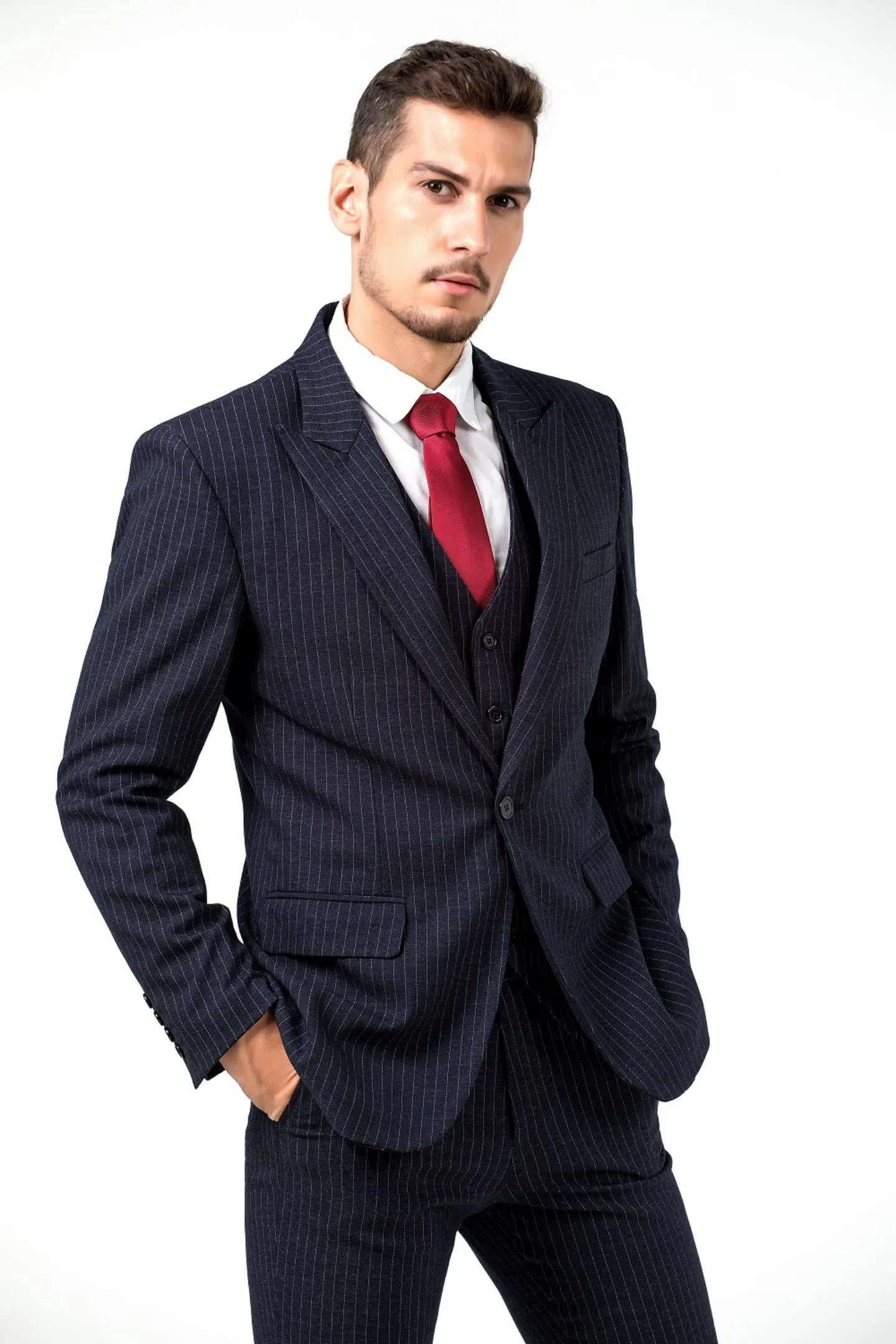 close-up view of navy slim fit pinstripe 3 piece men's suit – tailored jacket and vest with red tie, perfect for business and formal events.