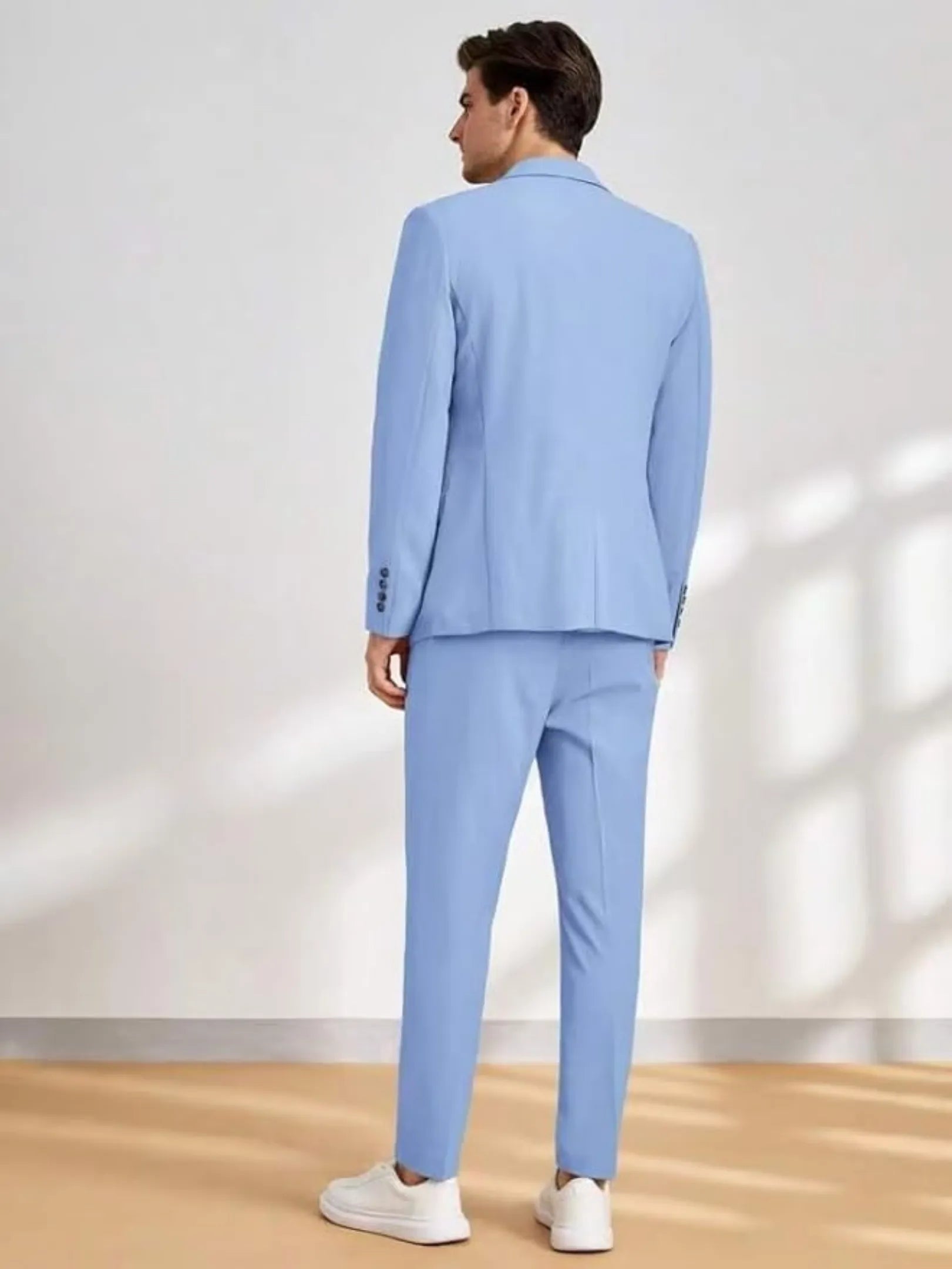 rear view of light blue men's wedding suit with modern fit and minimal design