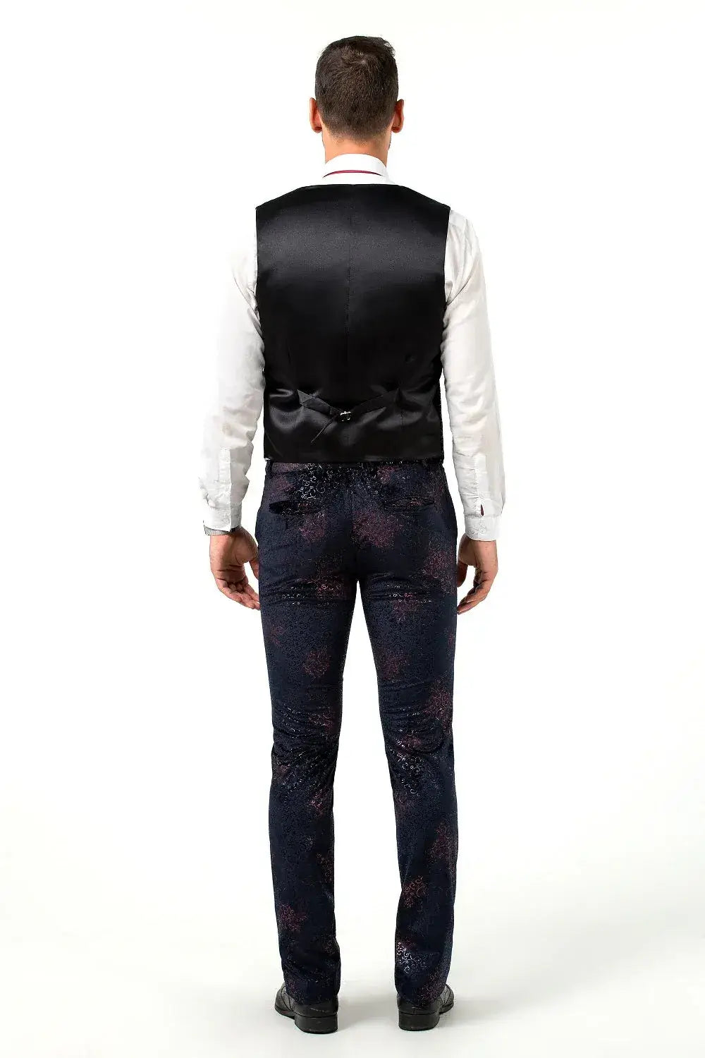Rear view of men's black satin-back vest with matching embossed navy trousers