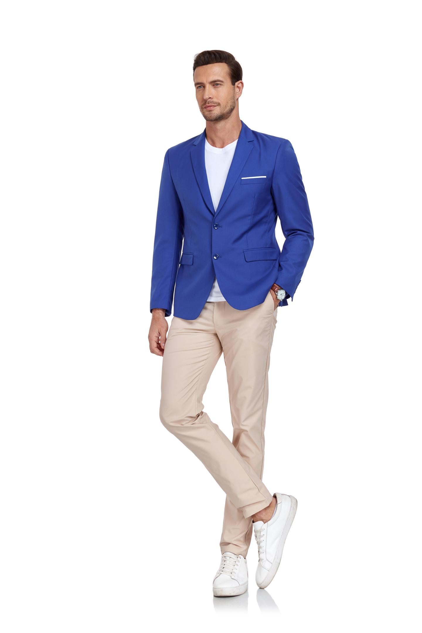 model standing in royal blue blazer, beige pants, and white sneakers – stylish for weddings and events.