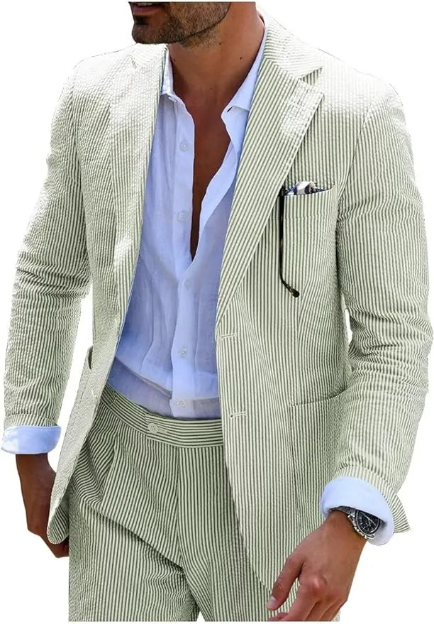Sage green-and-white striped seersucker blazer styled with a summer shirt for a fresh, elegant look.