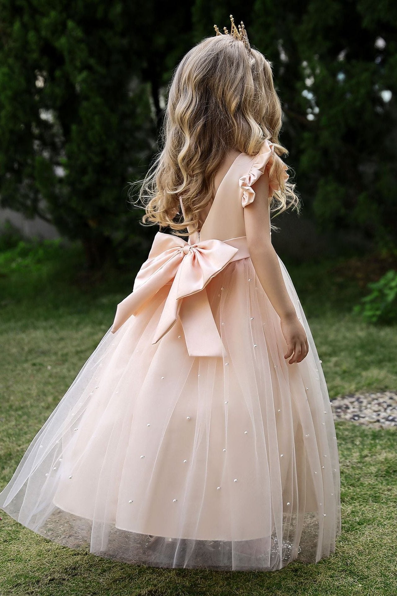 Wehilion satin flower girl dress in Champagne with a large bow and sheer overlay for special occasions