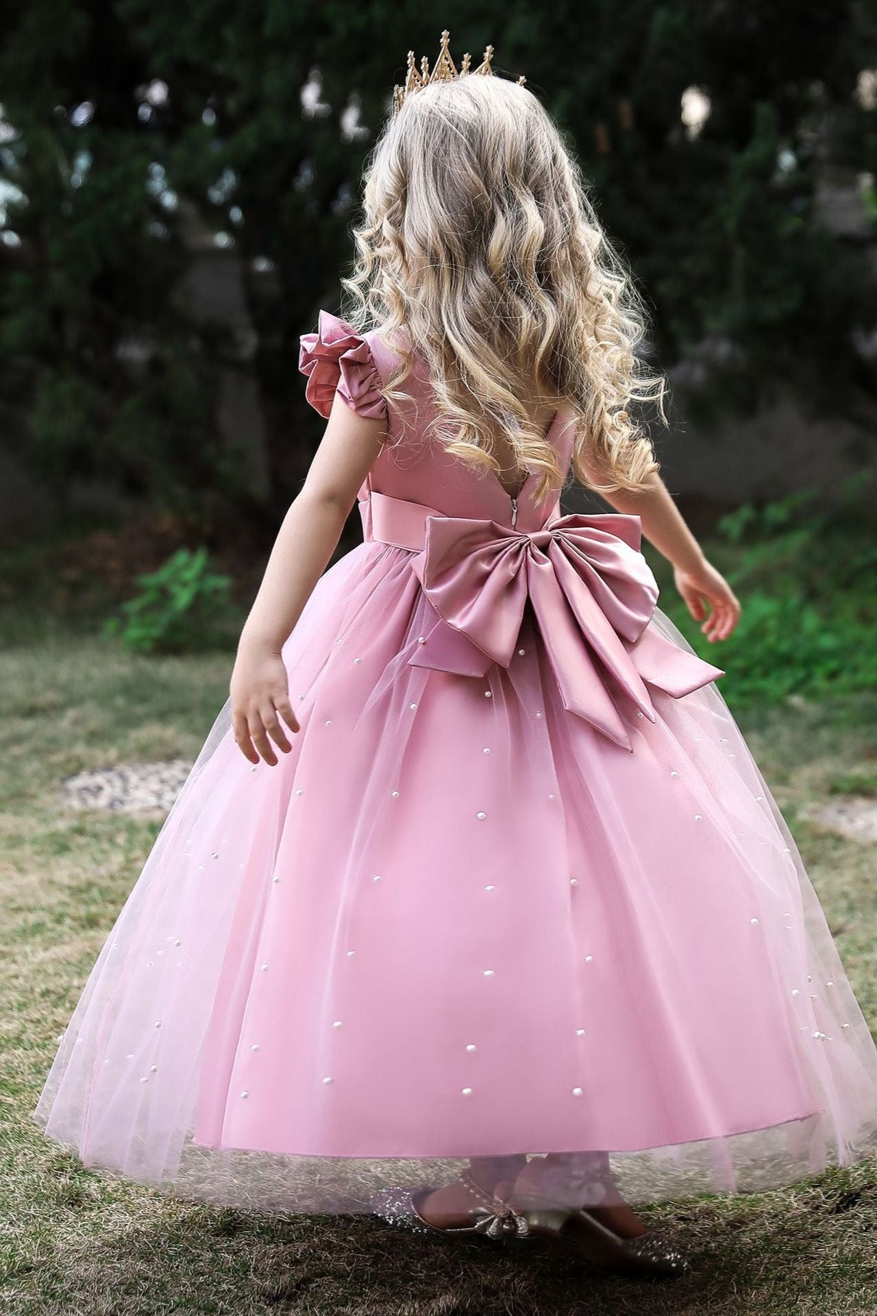 Wehilion satin flower girl dress in light pink with a bow and pearl accents for special occasions
