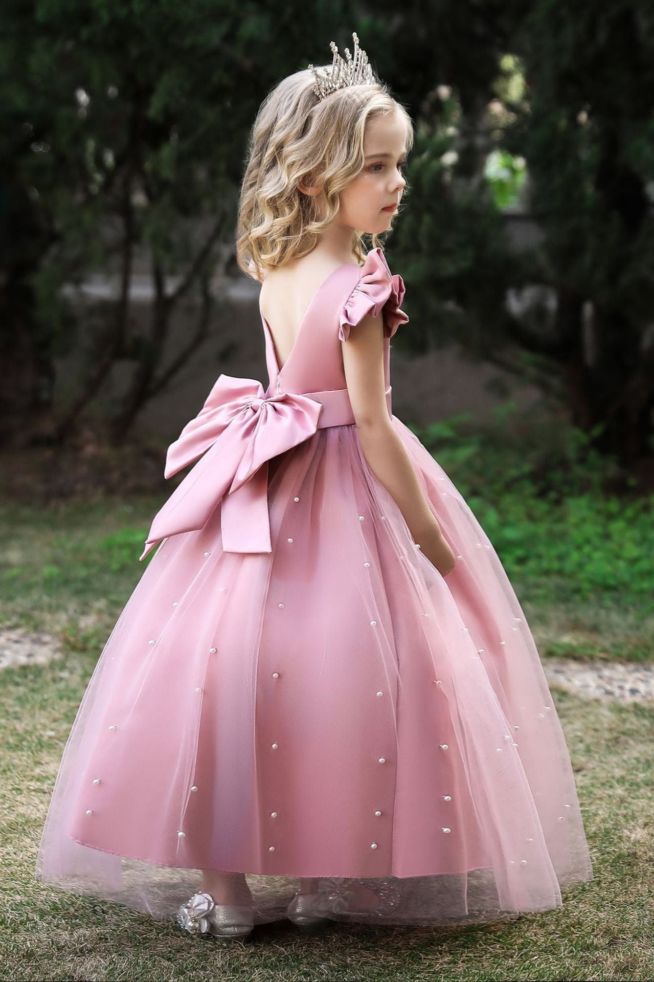 Wehilion satin flower girl dress in light pink with a bow and pearl embellishments for special occasions