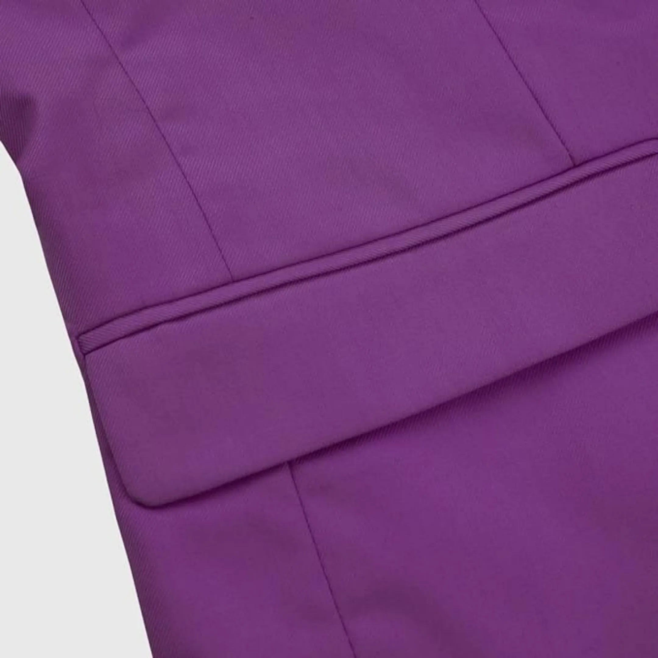 close-up view of the purple men's blazer side pocket and sleek tailoring, showcasing the fine craftsmanship and stylish finish of the suit.