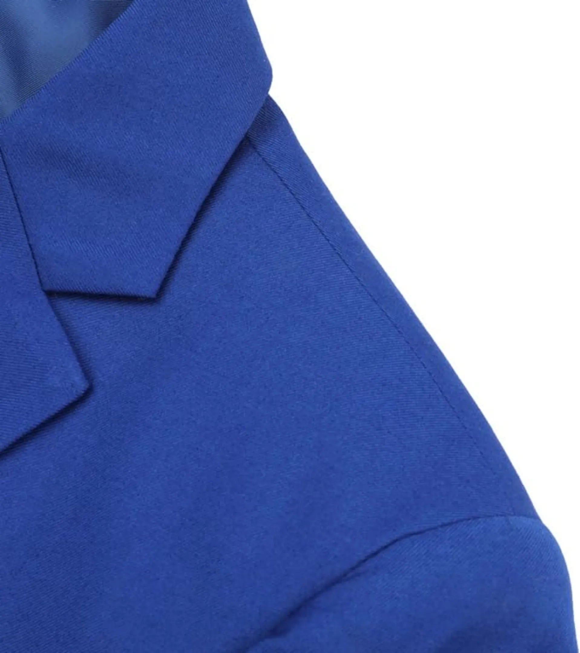 close-up of the royal blue men's blazer collar and shoulder detailing, highlighting the sharp, tailored construction and high-quality finish of the suit.