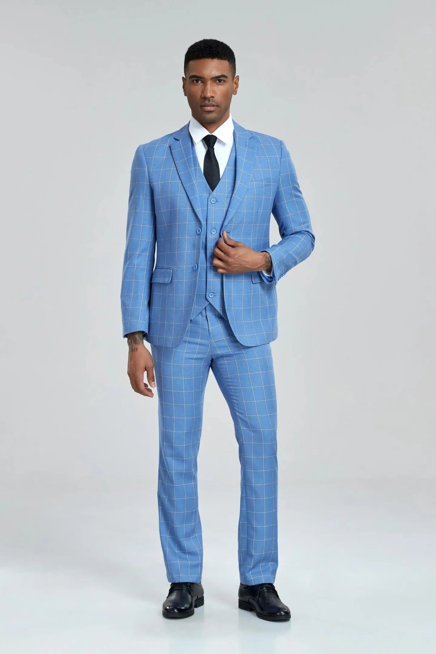 three-quarter view of the light blue plaid suit, jacket open to reveal the vest and detailed check pattern.