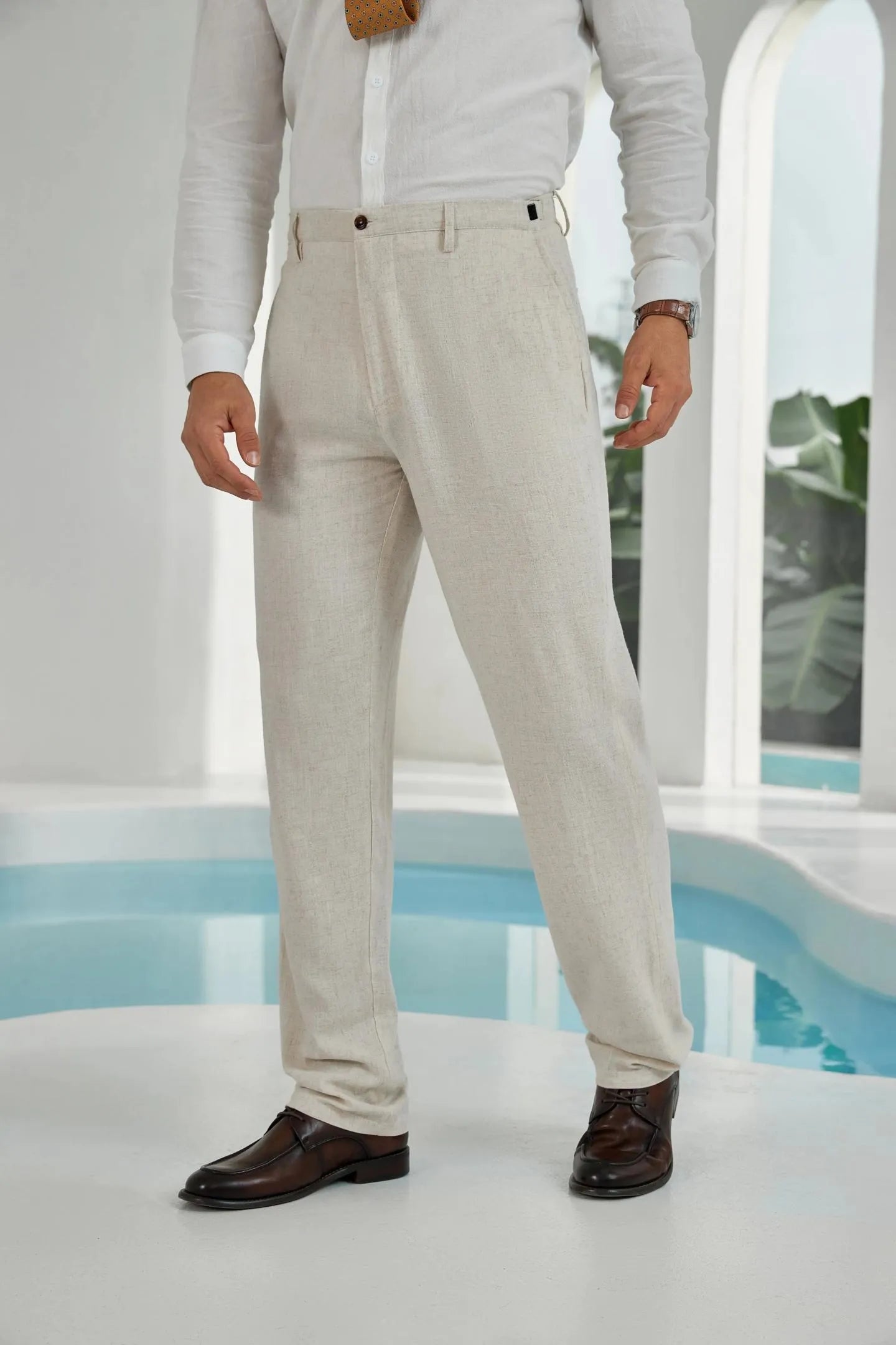 side angle of beige linen pants for men – lightweight breathable trousers paired with dress shirt for casual summer style