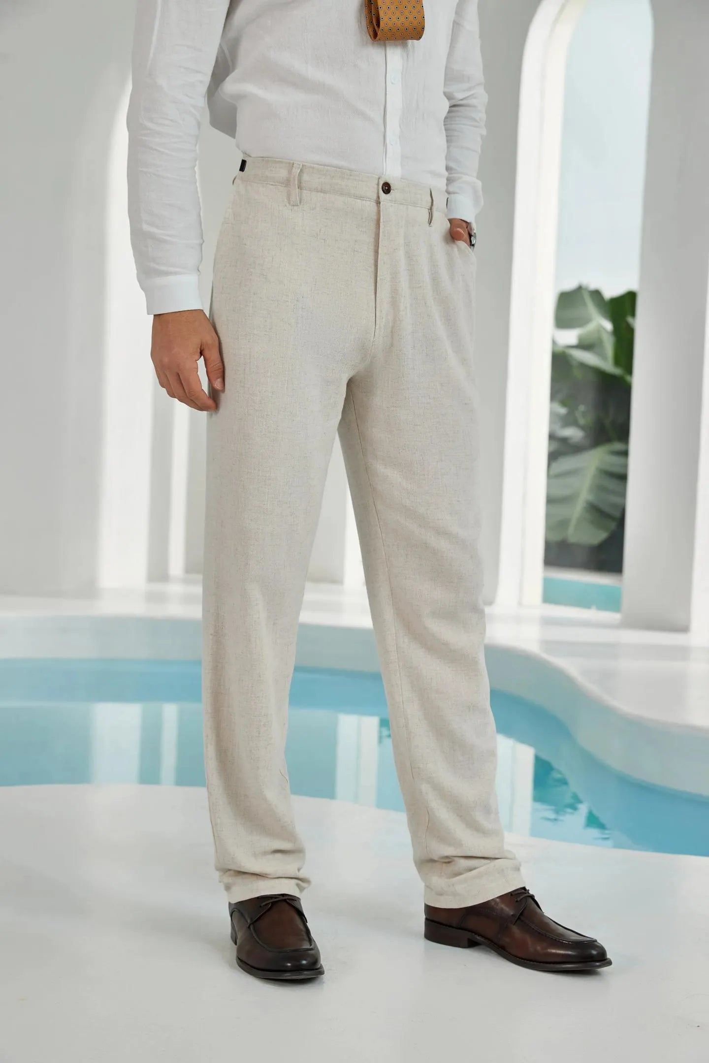 close-up of beige linen pants for men – elegant summer trousers designed for wedding suits and formal casual wear