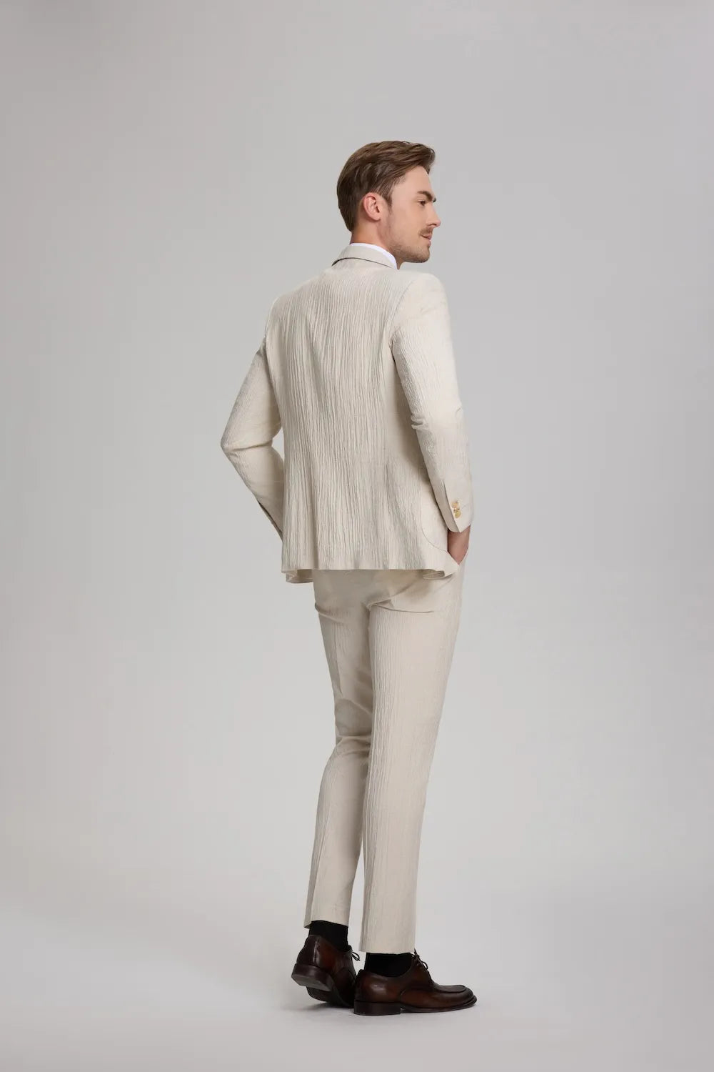 Back view of beige men's linen suit – breathable summer blazer and trousers set for weddings or formal wear