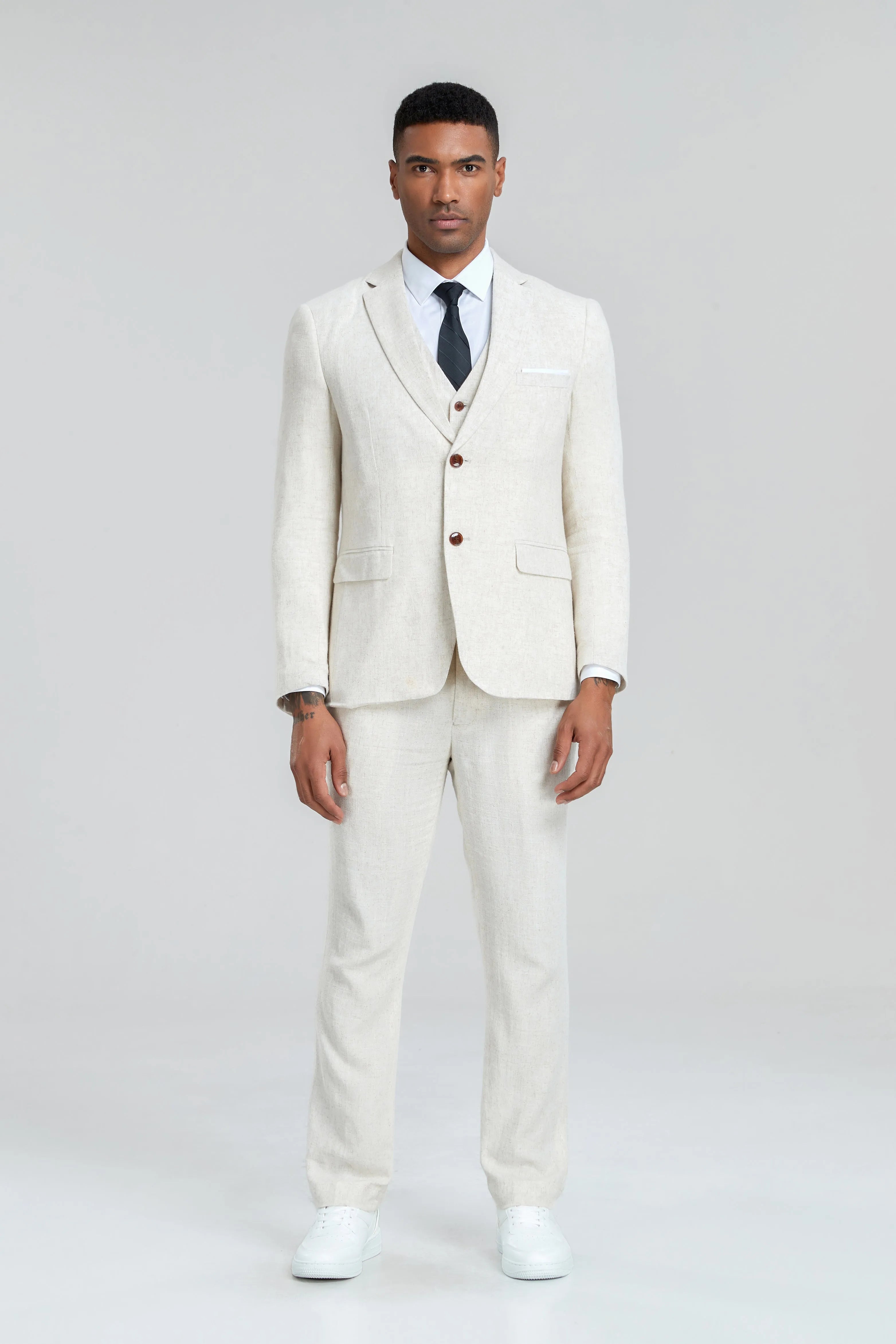 Beige linen vest and blazer with trousers – breathable three-piece men's suit styled with white sneakers