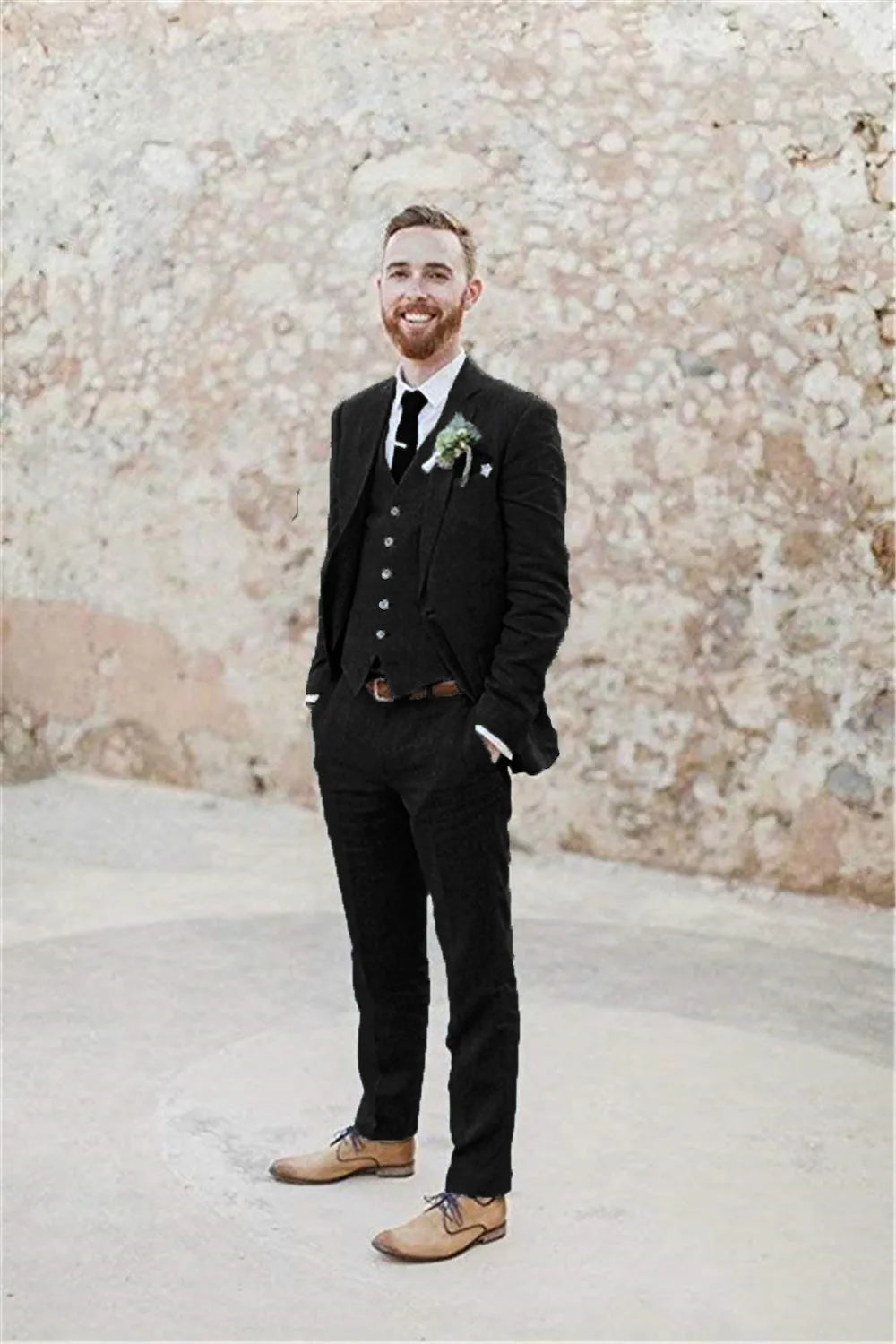 Full body view of men's black 3 piece linen suit – includes blazer, vest, and pants, styled with white shirt and tie, summer retro beach wedding look