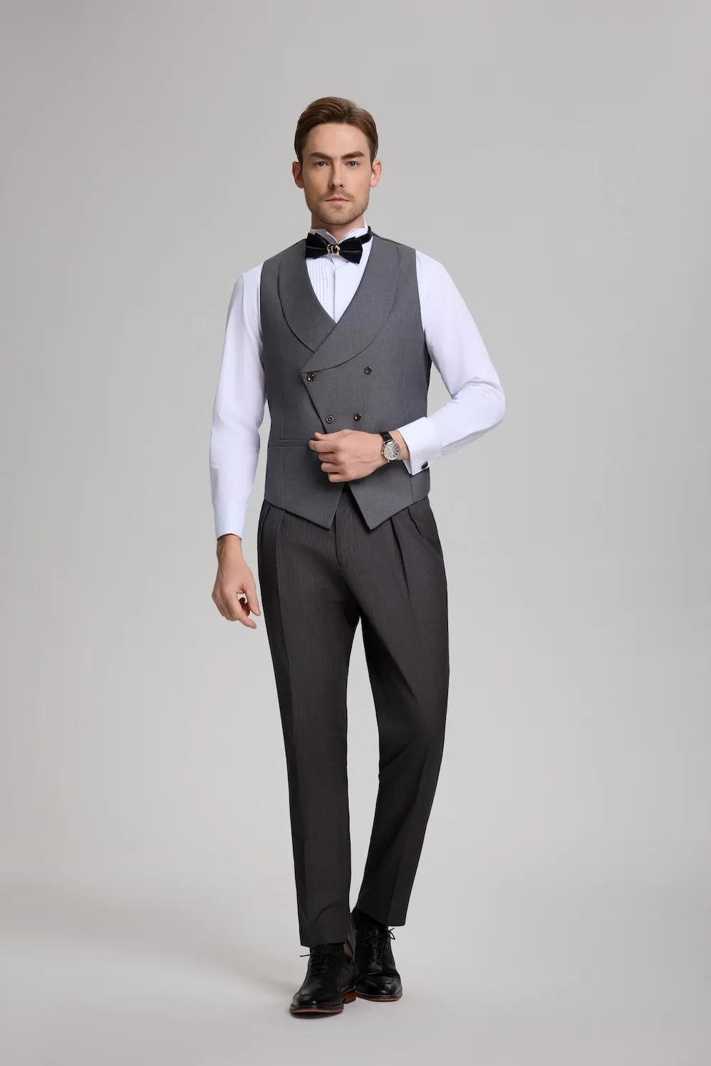 The grey double-breasted vest and formal striped trousers from the 3-piece suit, styled without the tailcoat jacket.