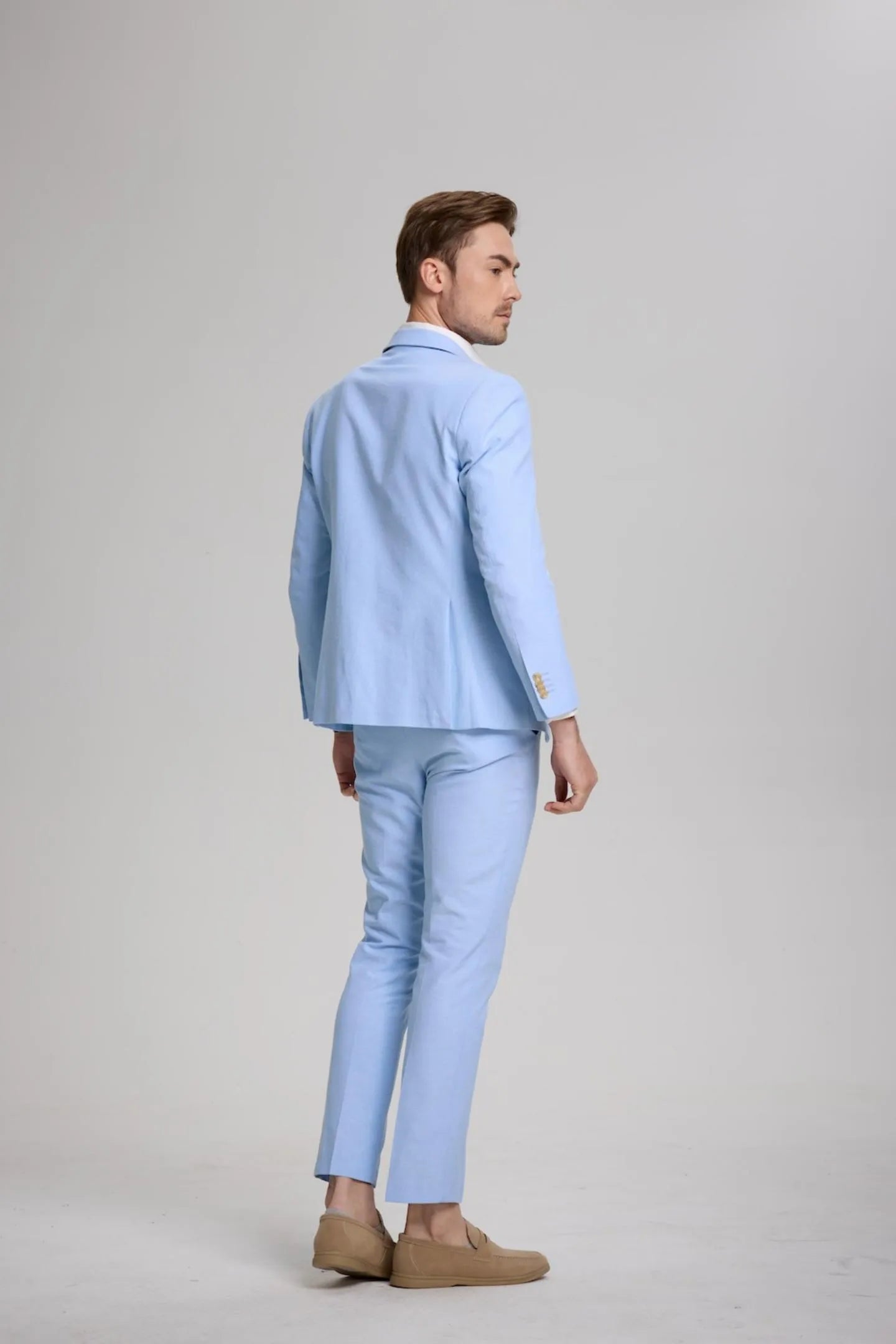 back view of men's blue slim fit 2-piece suit, modern blazer with matching pants for a stylish and comfortable fit.