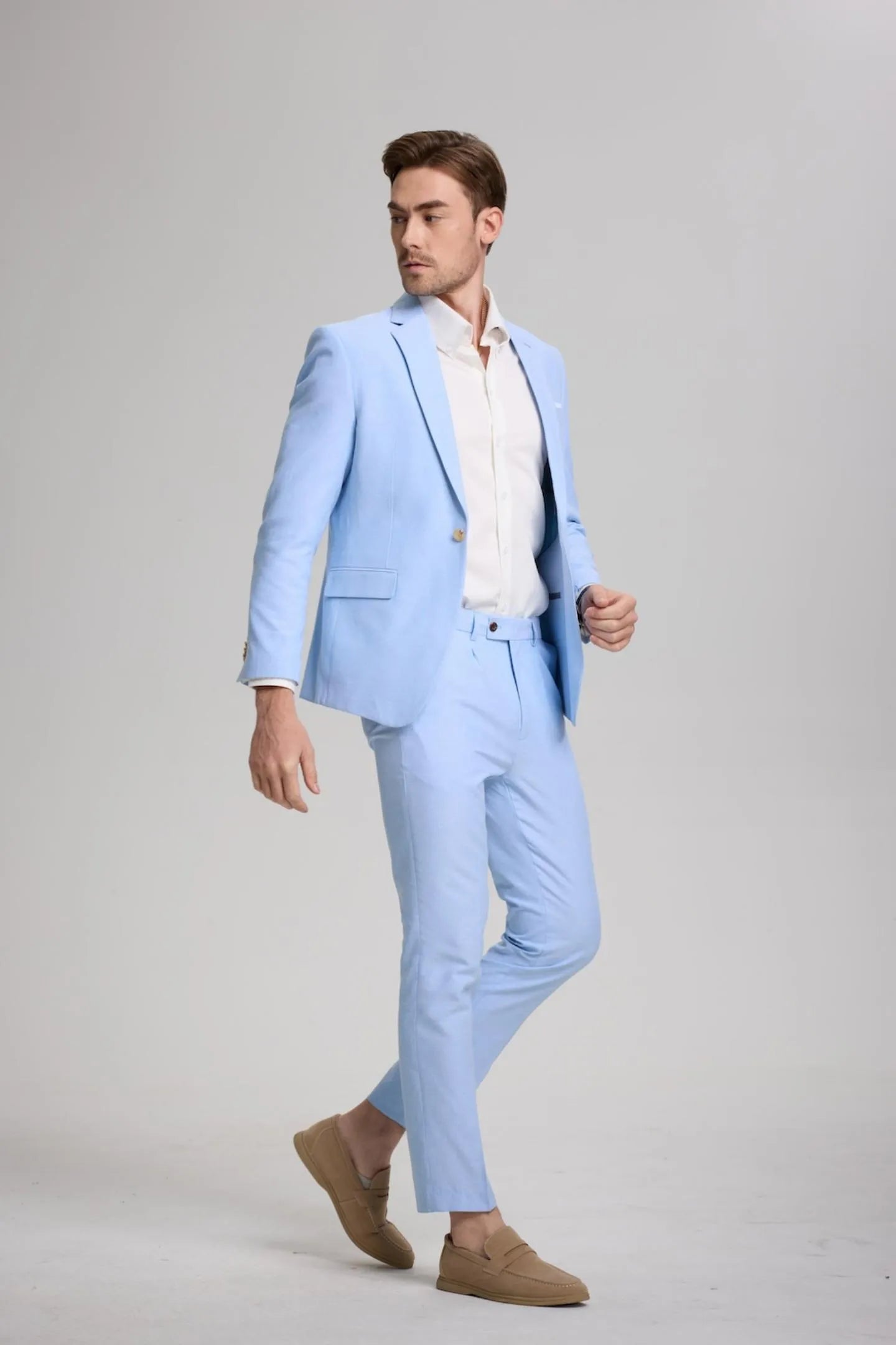 men walking in blue casual slim fit 2-piece suit, modern blazer and pants for a relaxed yet polished look.
