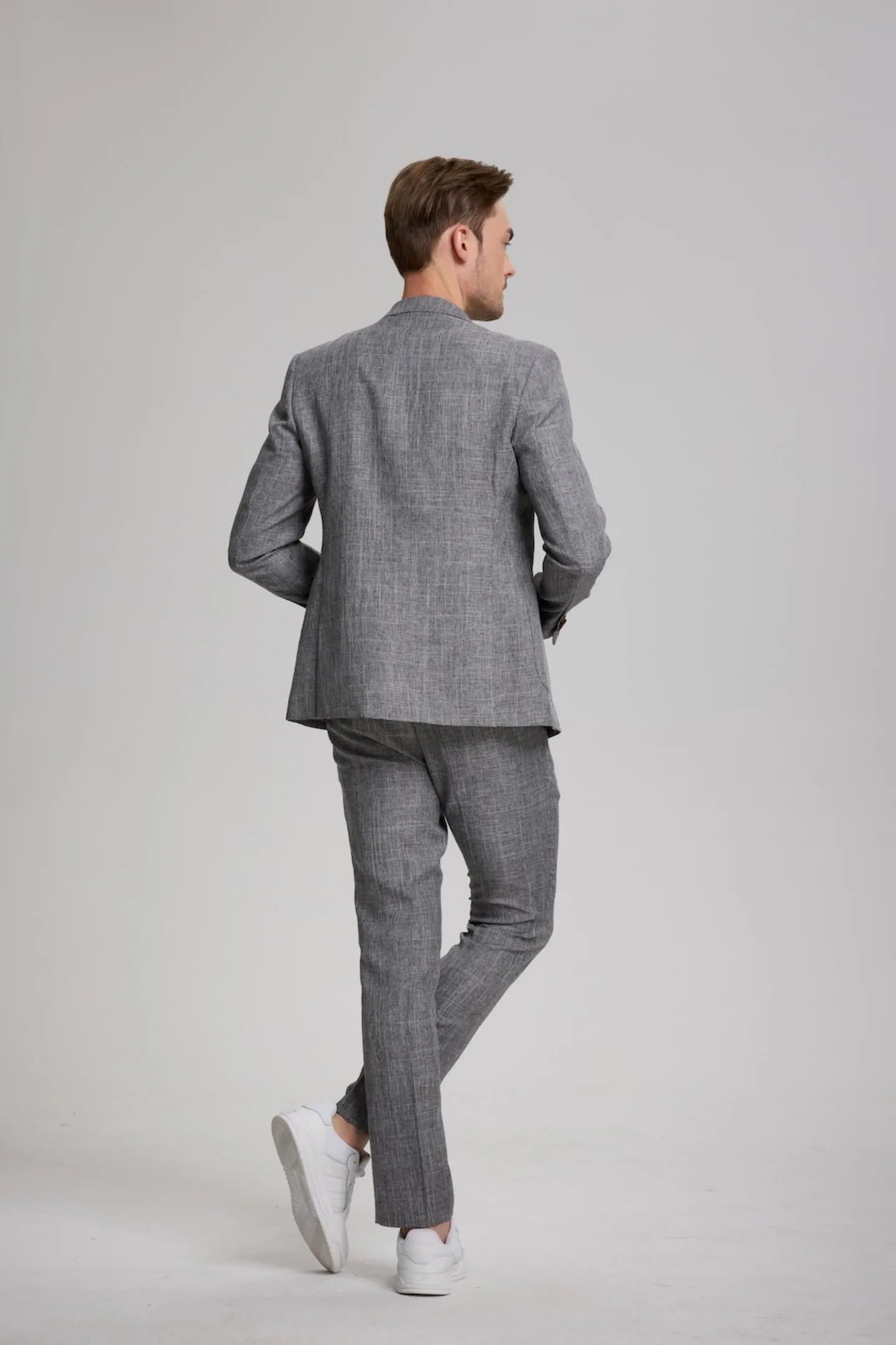 back view of men's dark grey formal 3-piece suit – perfect fit for wedding and business events.