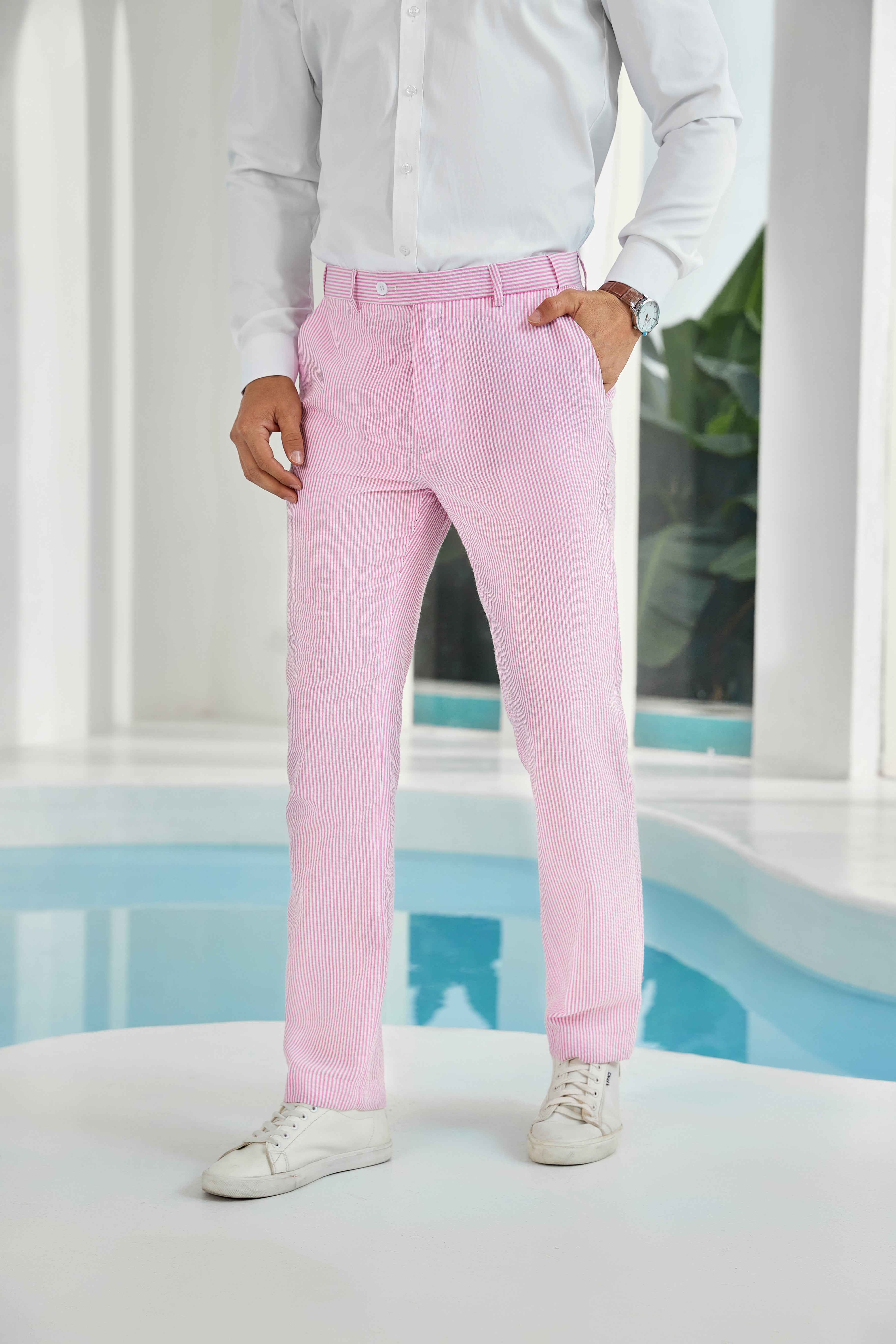 Front view of dark pink seersucker pants with subtle stripes and white shirt