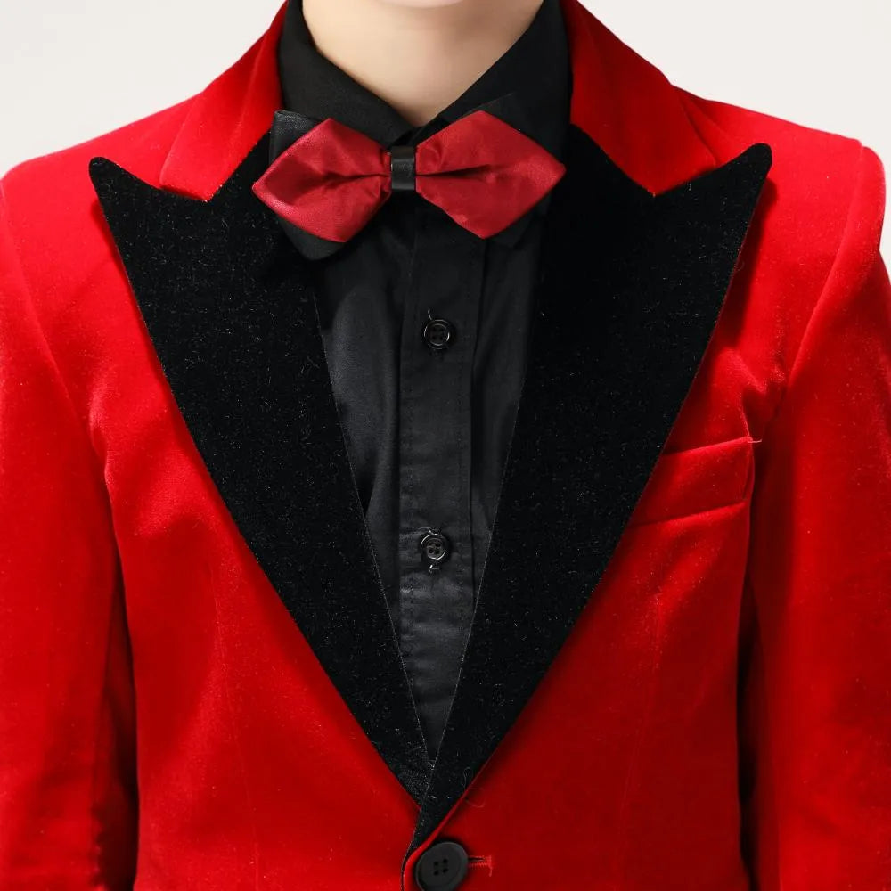 Close-up of red bow tie and black velvet lapel on boys' red velvet formal jacket