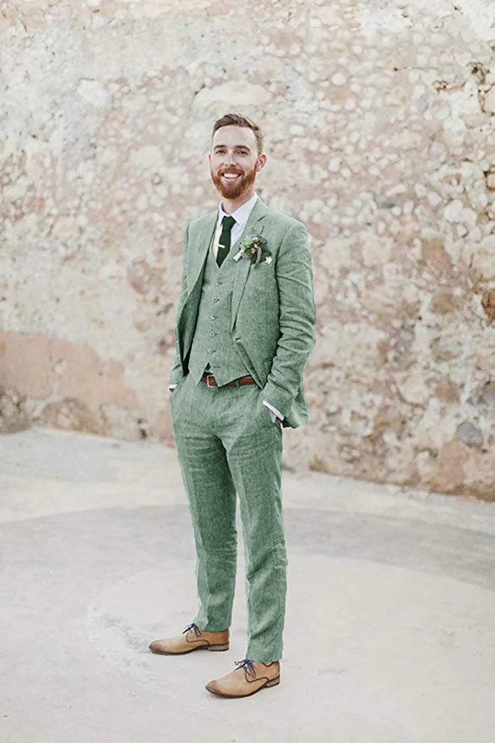 Full body view of men's green 3 piece linen suit – slim fit summer wedding outfit with vest, blazer, and trousers, styled with brown dress shoes