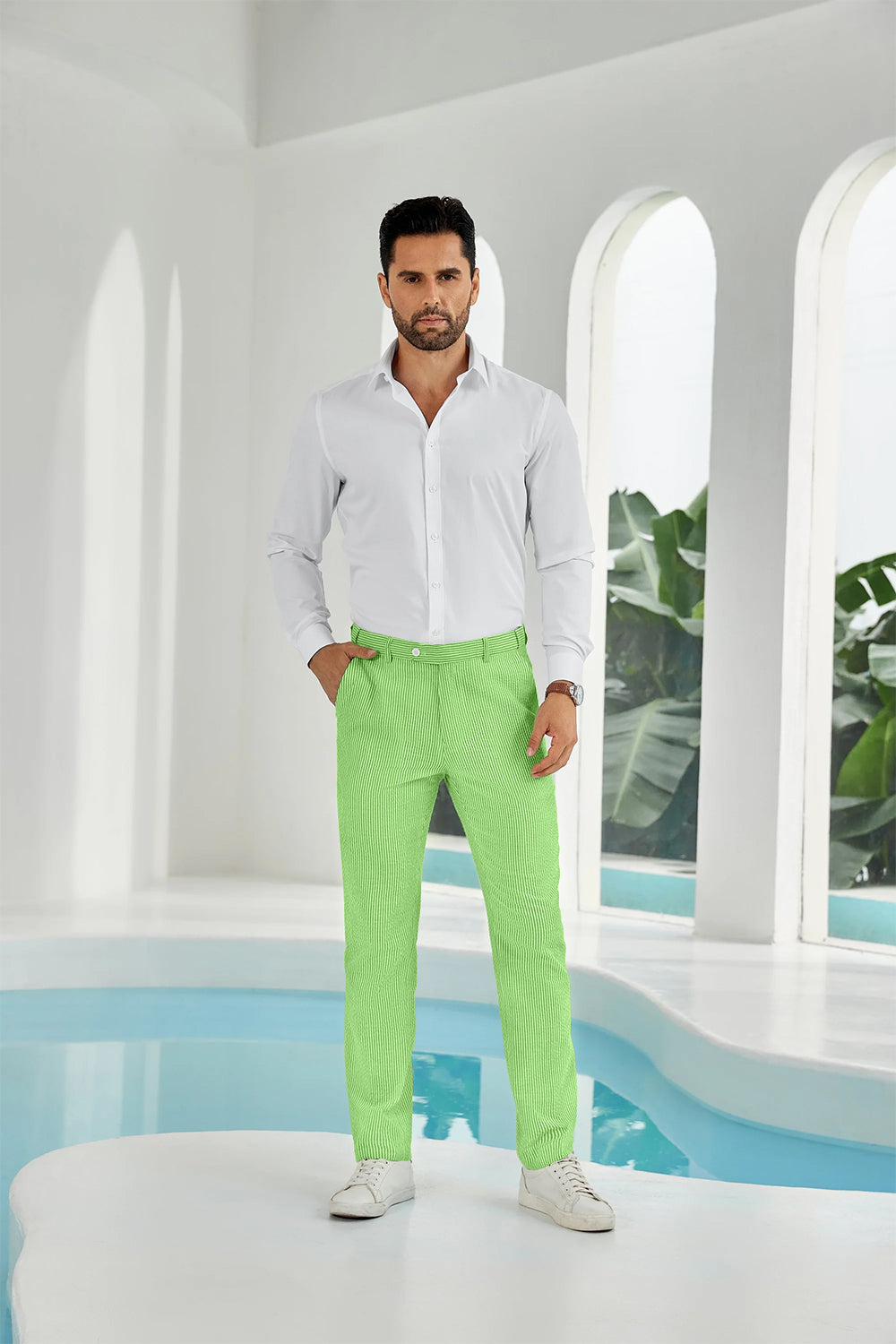 Full-body look: man in green seersucker pants, white shirt, and sneakers