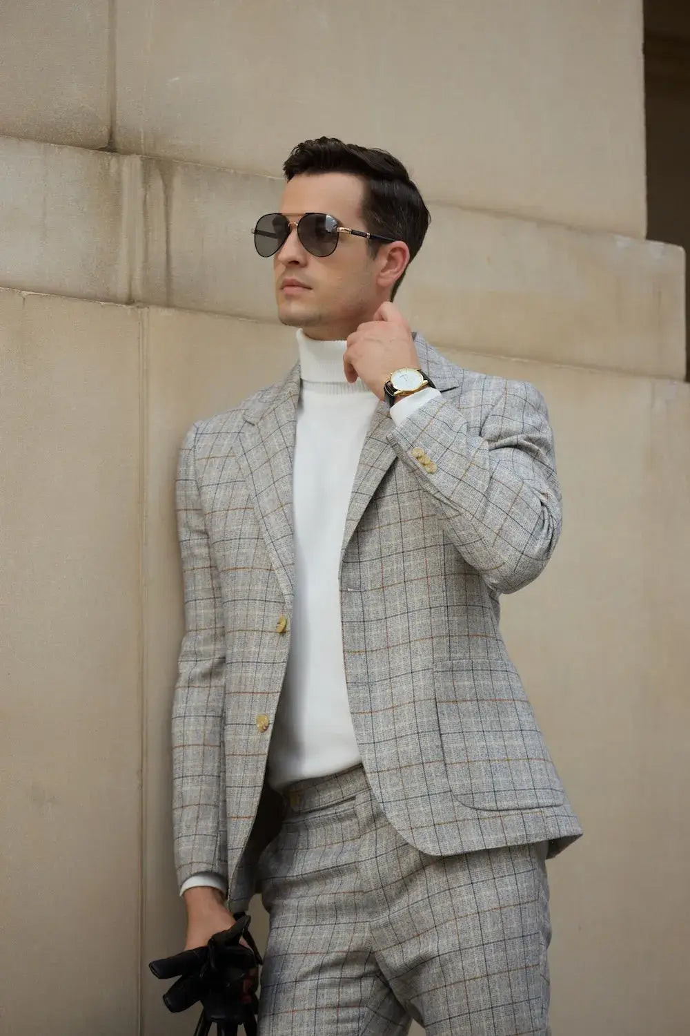 close-up of men's grey plaid summer suit blazer – showcasing stylish accessories like gloves and watch, designed for formal work events