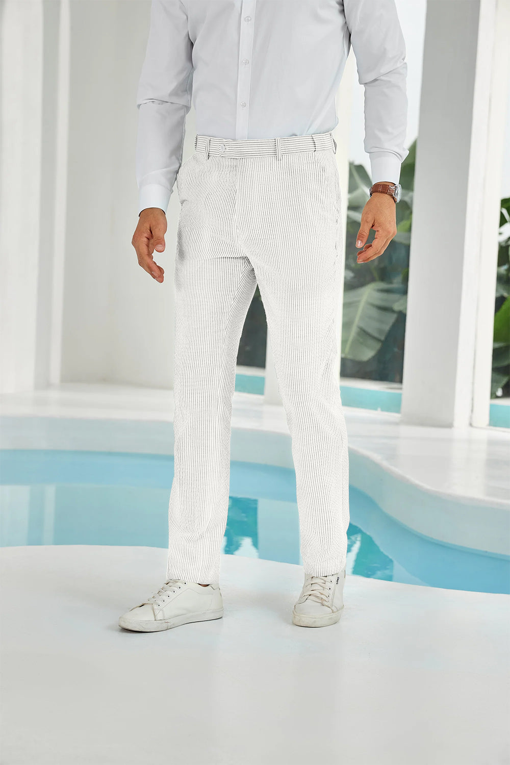 Front view of ivory white seersucker pants with subtle stripes and white shirt