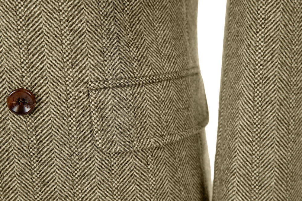 Men's khaki wool overcoat - close-up of herringbone pattern fabric, brown button & welt pocket detail on urban double breasted coat