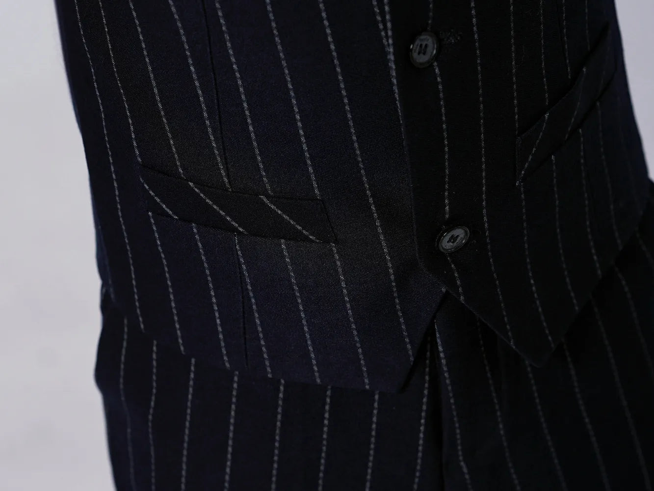 Navy striped slim fit pants and vest pocket – tailored boy's formal outfit with classic charm