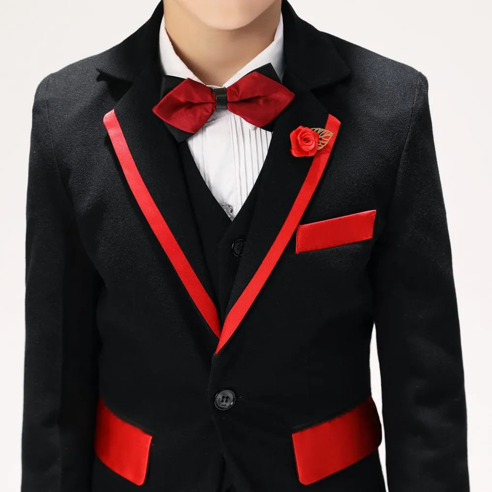 Close-up of boys' prom suit with red satin lapel trim, bow tie, rose pin, and formal pleated shirt