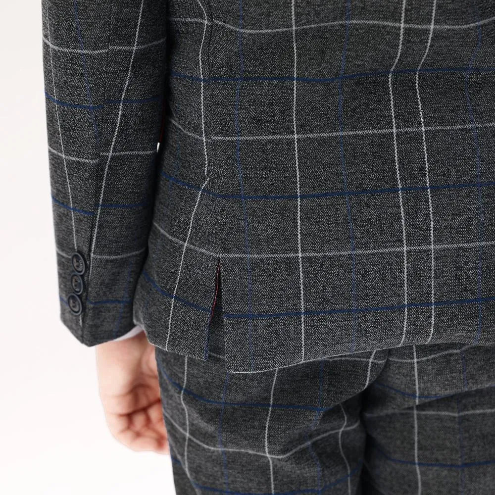 Detailed shot of dark grey check blazer buttons and flap pockets for boys