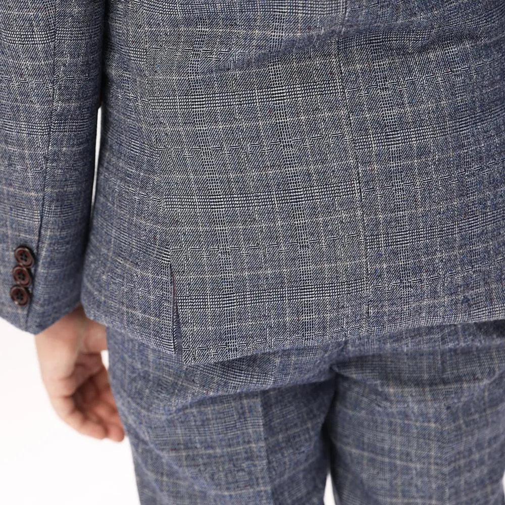 Detail shot of suit hem and back vent showcasing fine tailoring of boys grey plaid blazer